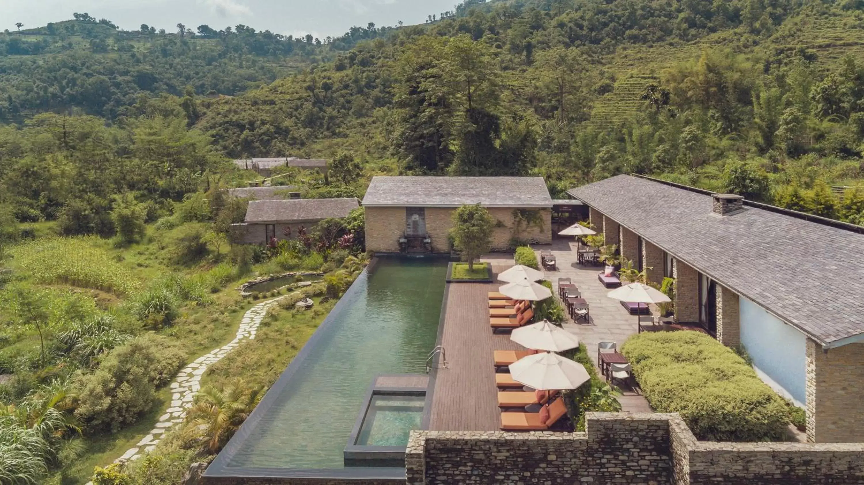 Swimming pool, Bird's-eye View in The Pavilions Himalayas The Farm
