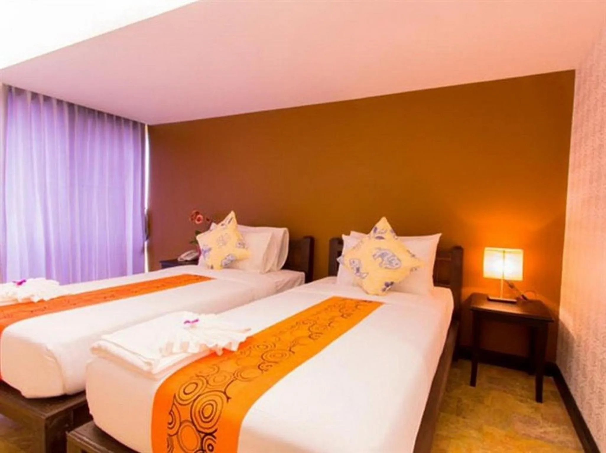 Bed in All Together Suite Hotel