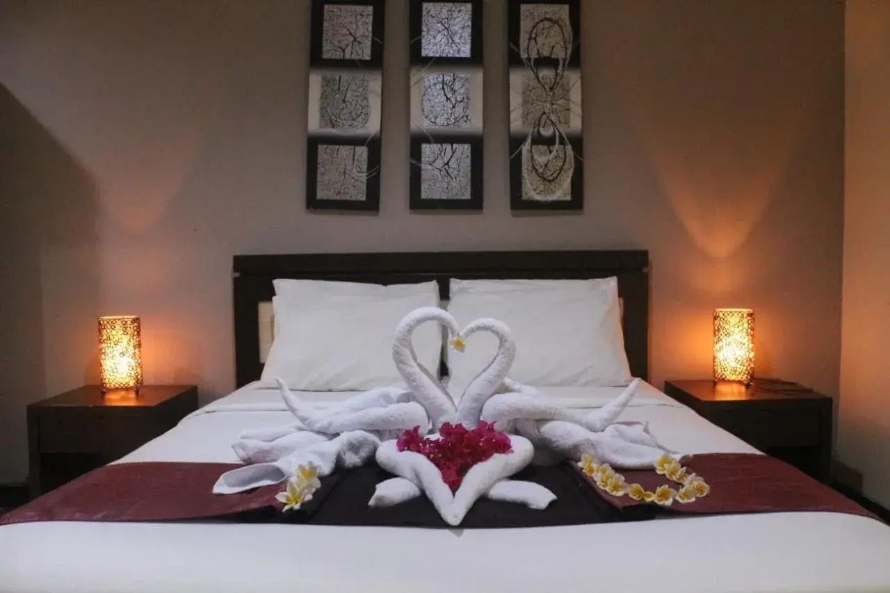 Bed in Mansu Hotel and Spa Legian