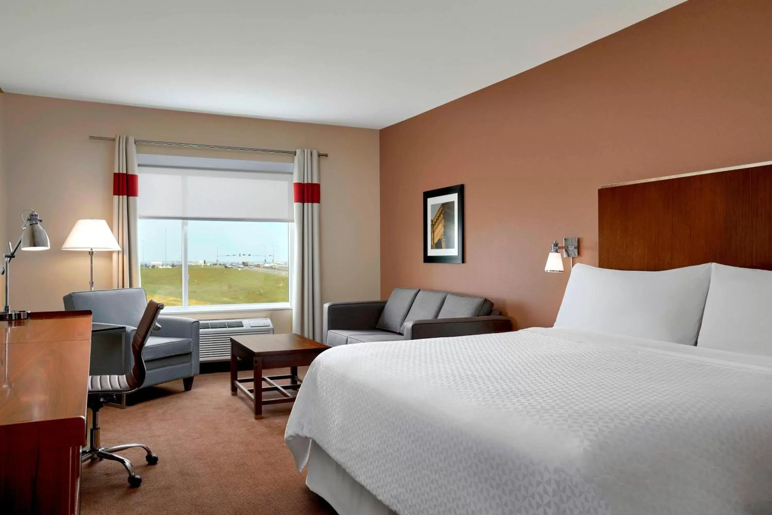 Photo of the whole room, Bed in Four Points by Sheraton Grande Prairie