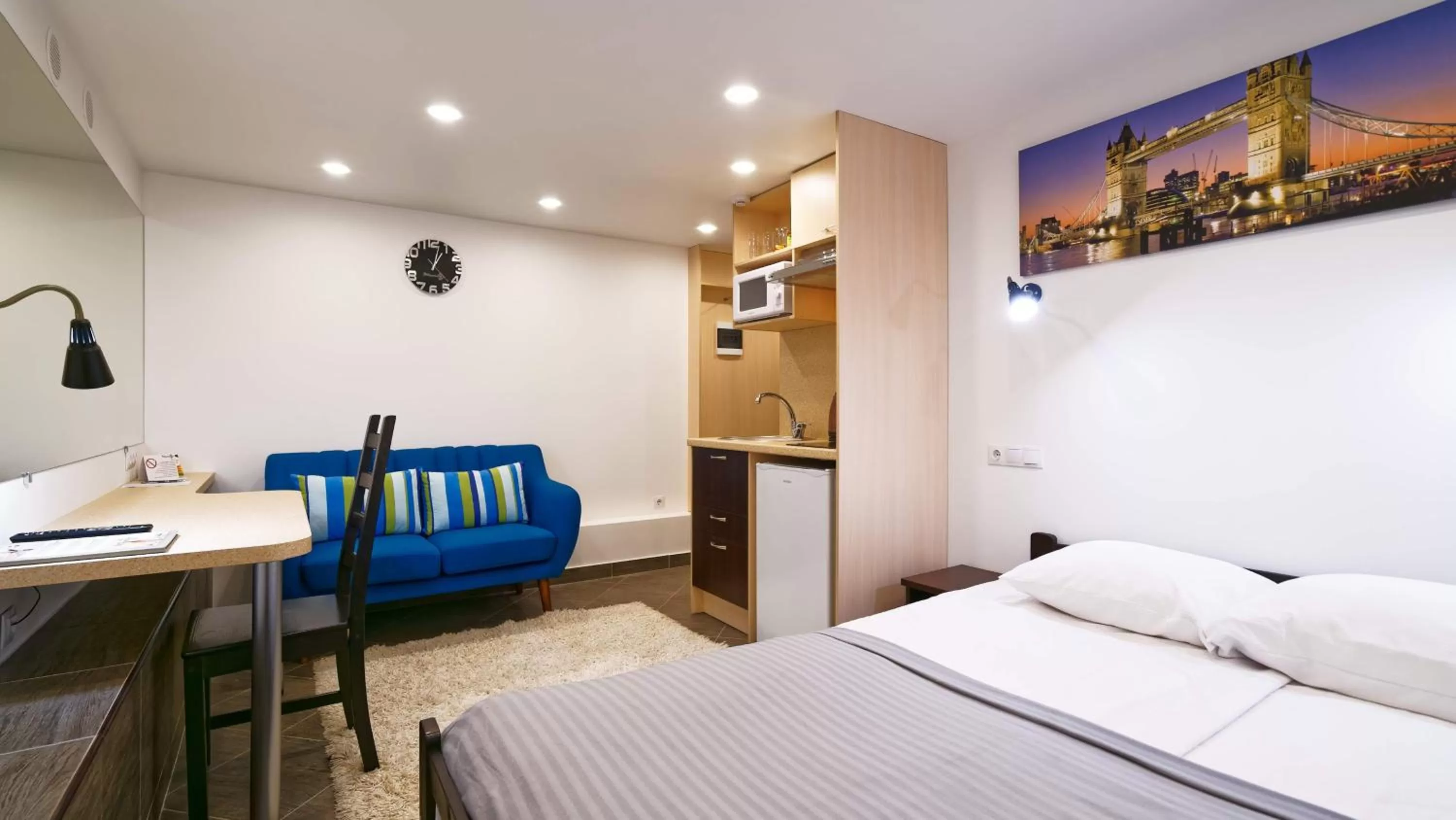 Kitchen or kitchenette, Bed in RIGAAPARTMENT SONADA Family Aparthotel - Private Parking