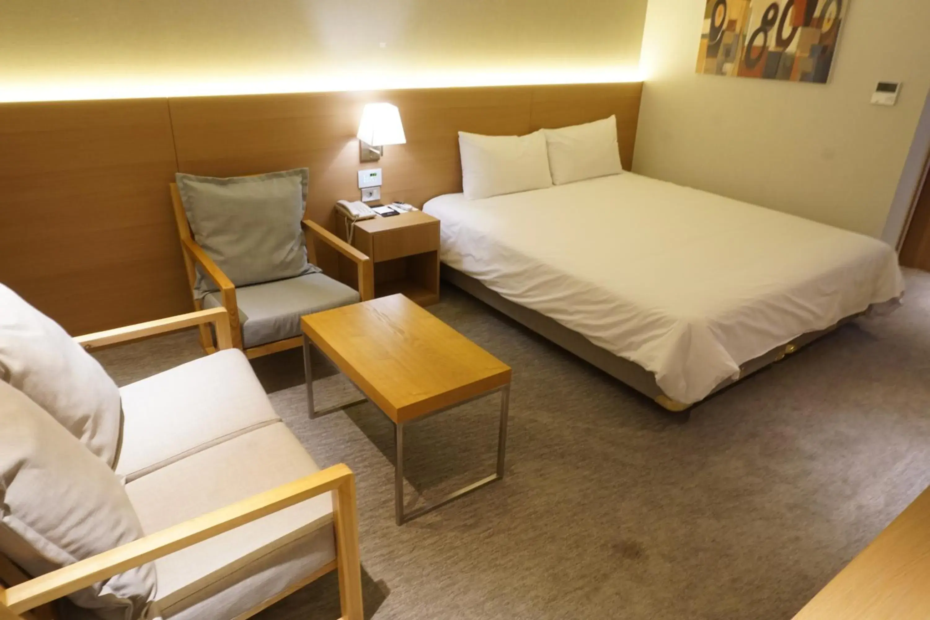 Seating area, Bed in Astar Hotel Jeju