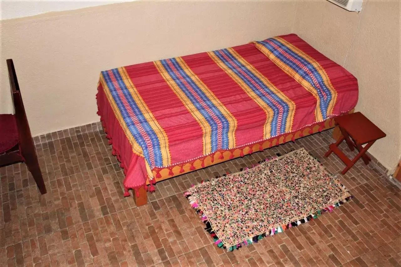 Bed, Seating Area in Cabañas Rústicas El Benny by Rotamundos