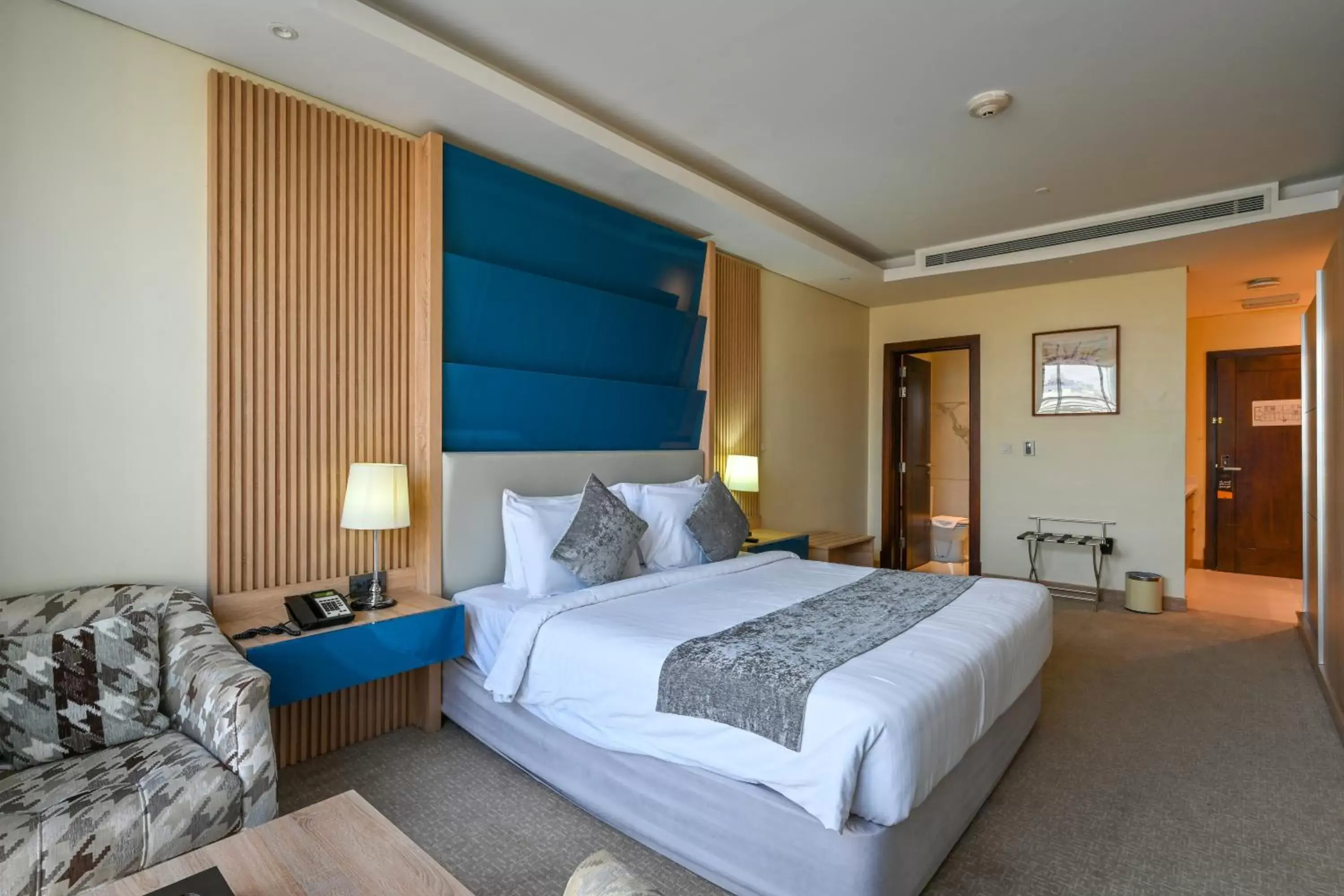 Bed in Al Mansour Suites Hotel