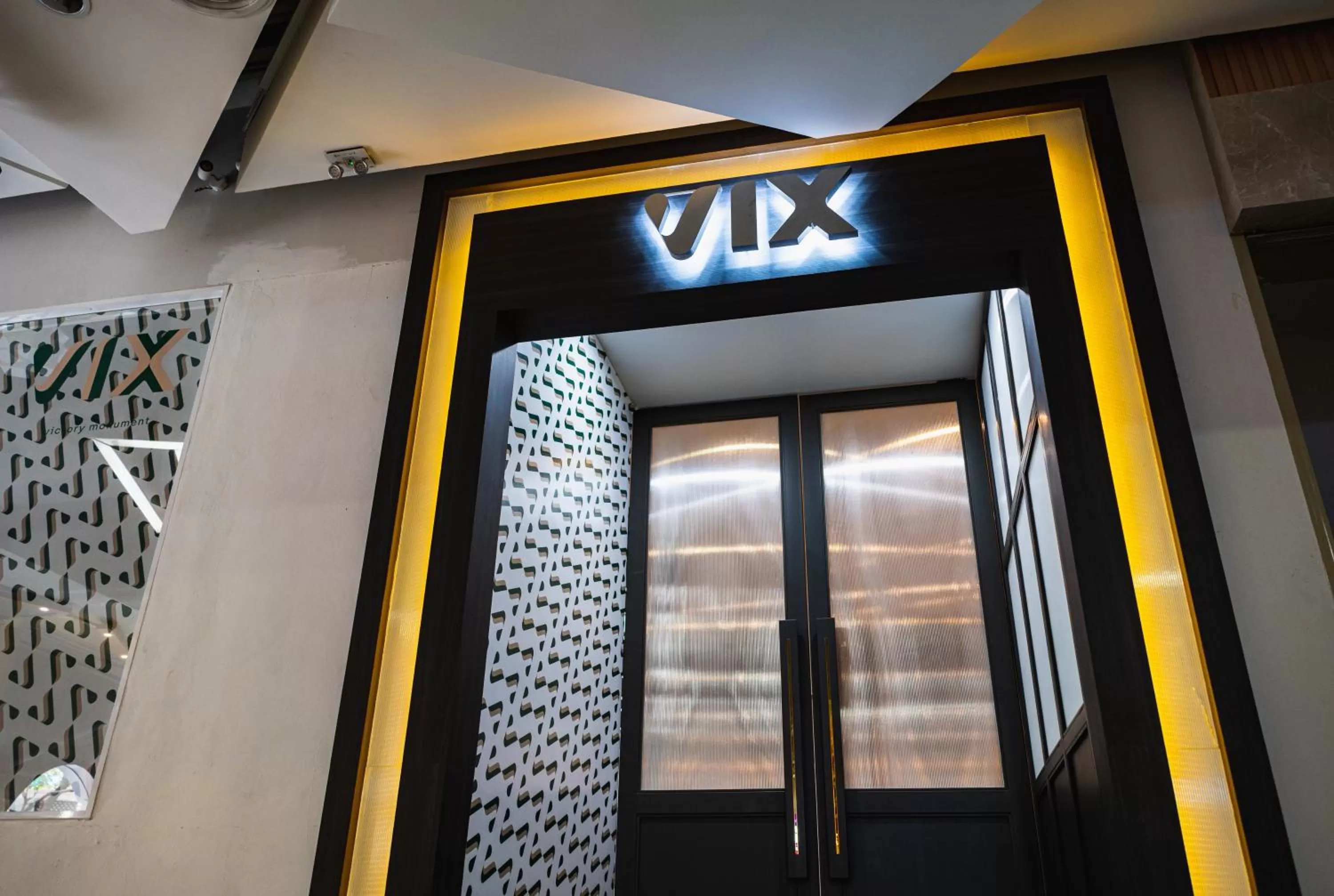Property logo or sign in VIX Bangkok at Victory Monument