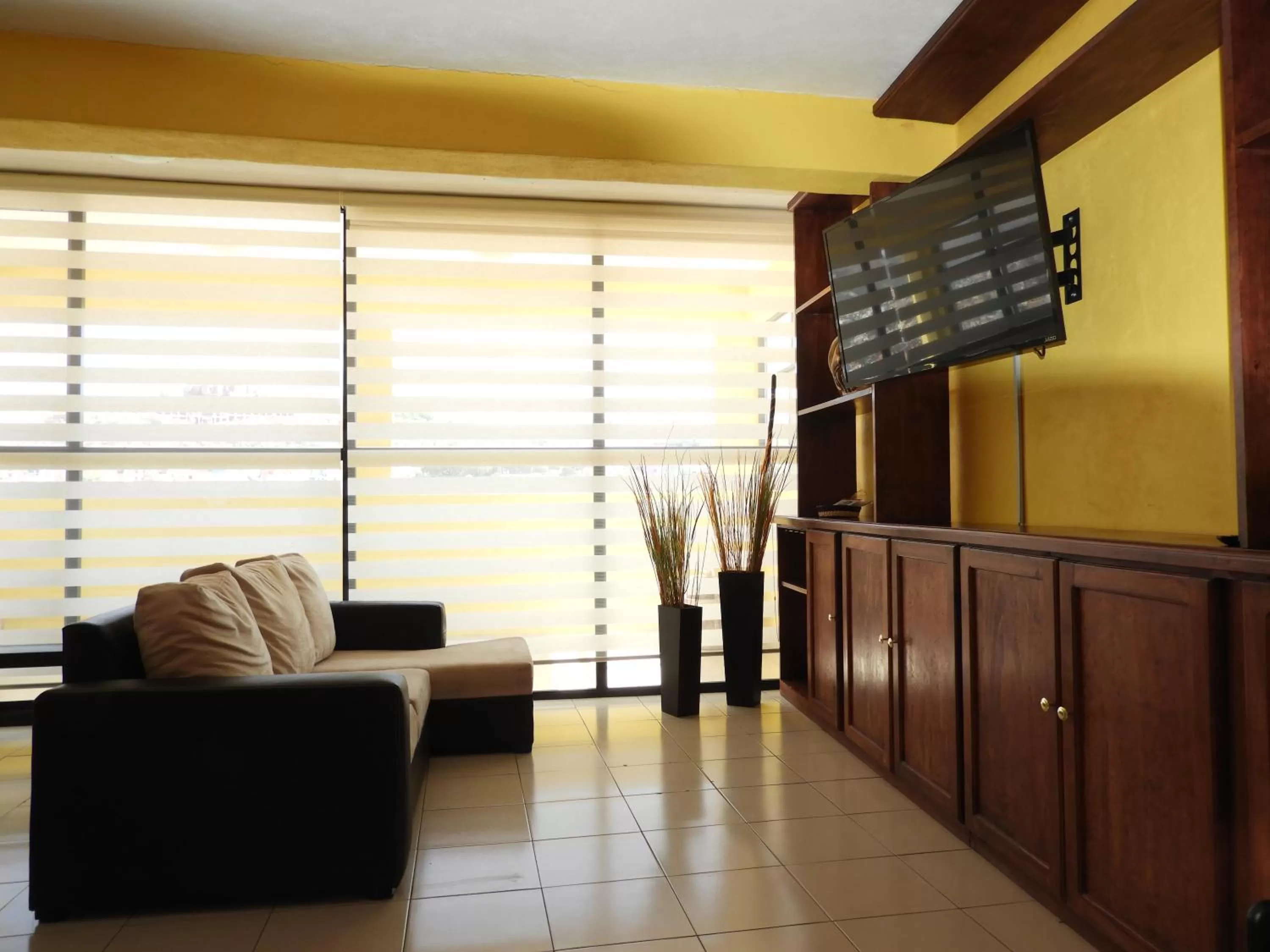 Communal lounge/ TV room in La Lotería Panoramic House & Rooftop by Lunian