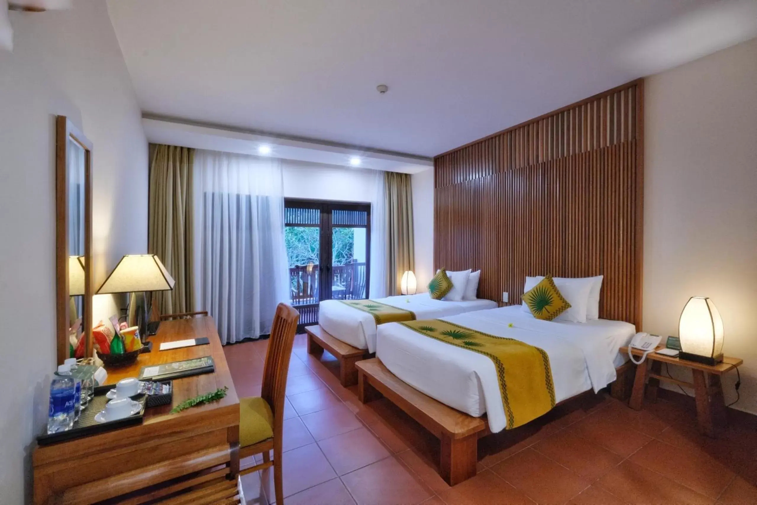 Bed in Palm Garden Beach Resort & Spa