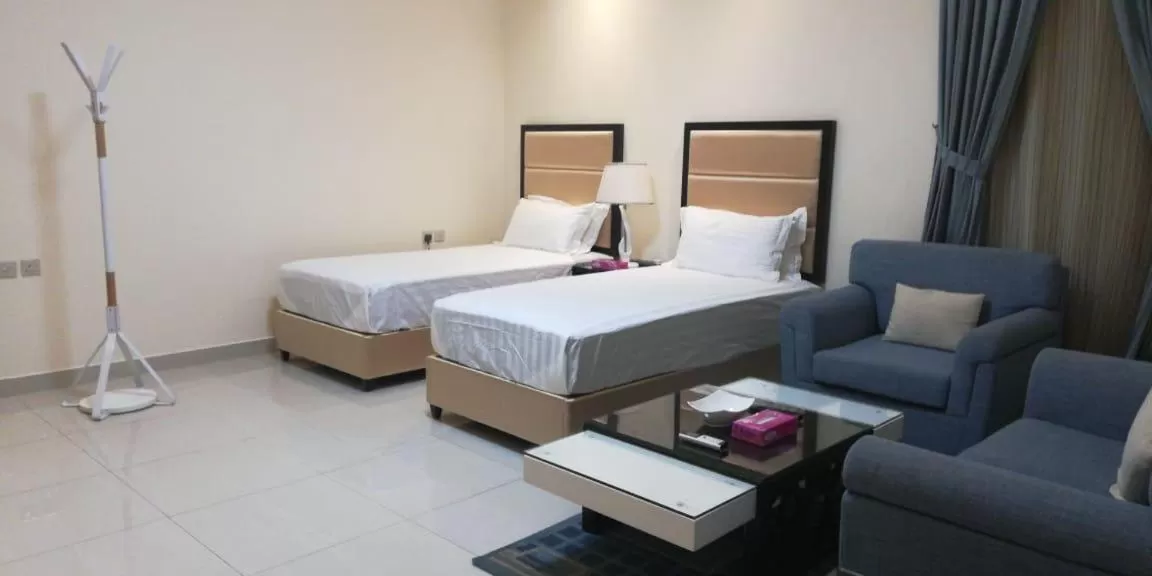 Bed in Arjaan Altakhassusi Hotel Suites