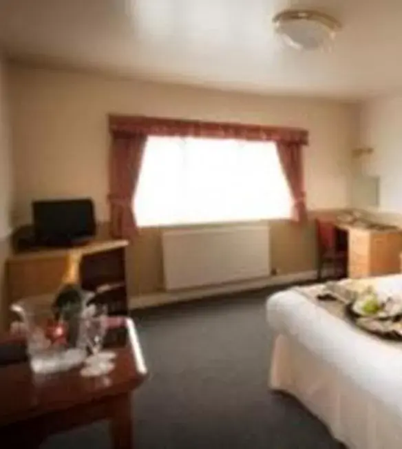 Photo of the whole room, TV/Entertainment Center in Moreton Park Hotel