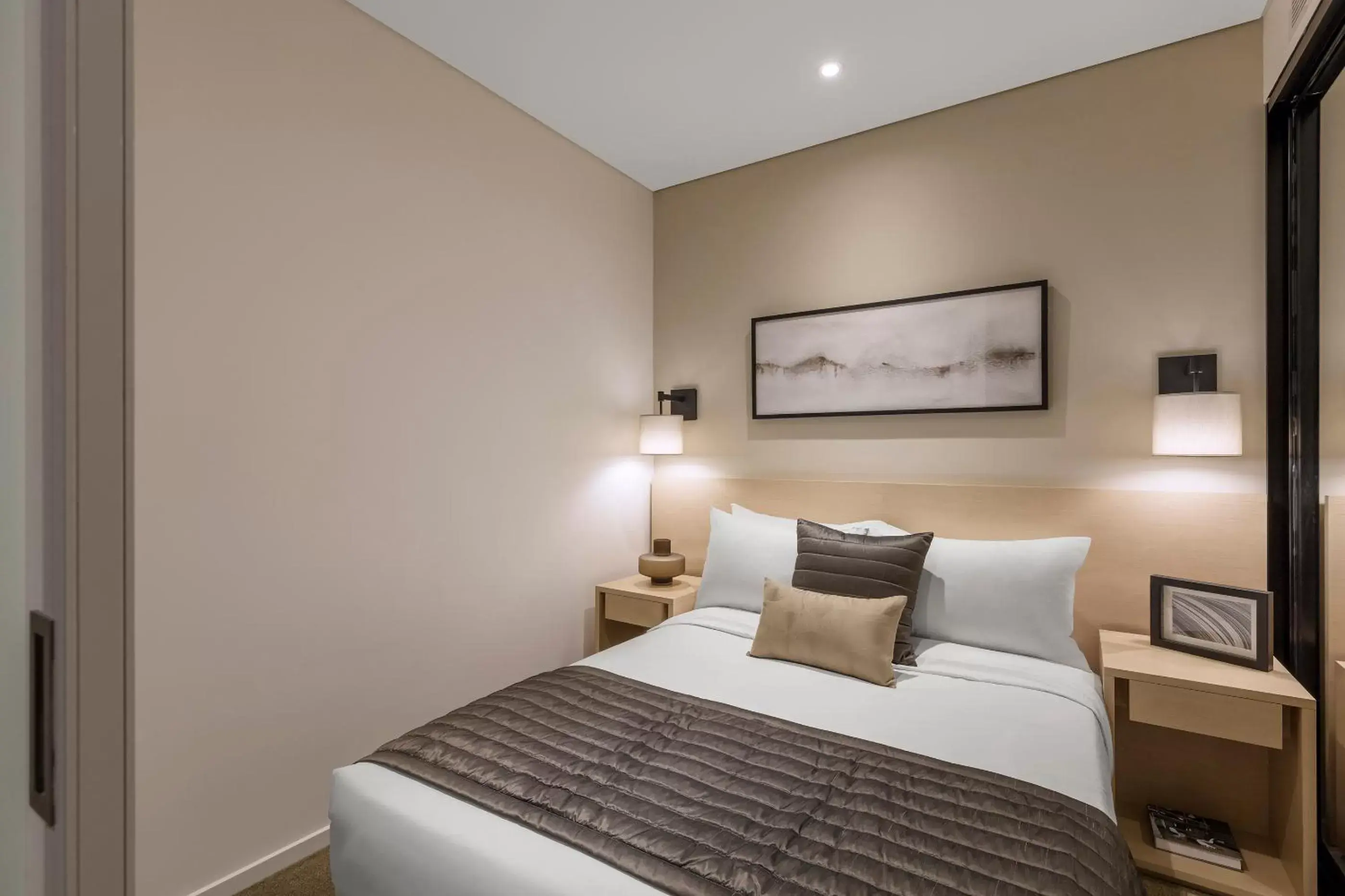 Bed in SKYE Hotel Suites Parramatta