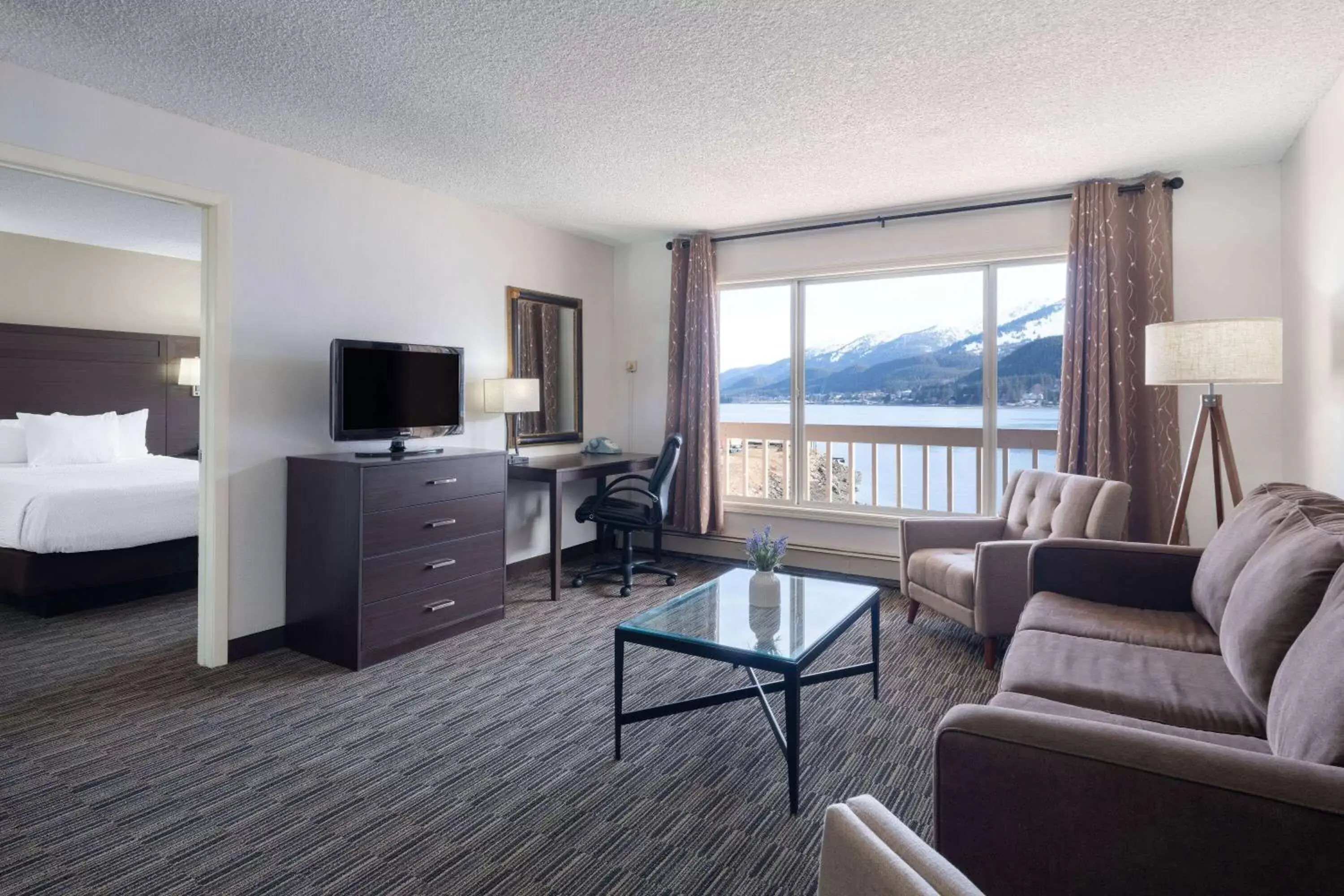 Bed, Seating Area in Ramada by Wyndham Juneau