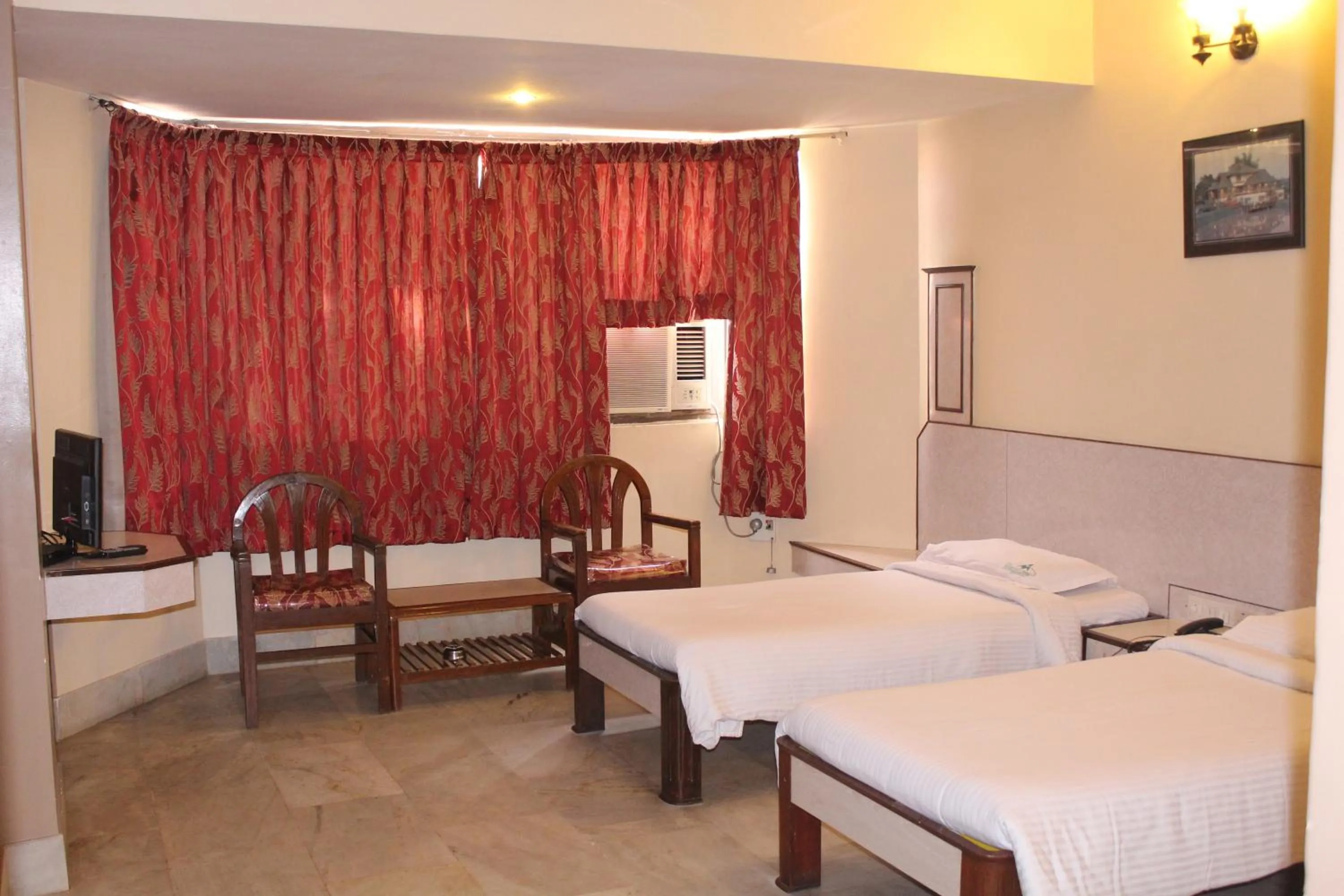 Photo of the whole room, Bed in Hotel Mangalore International