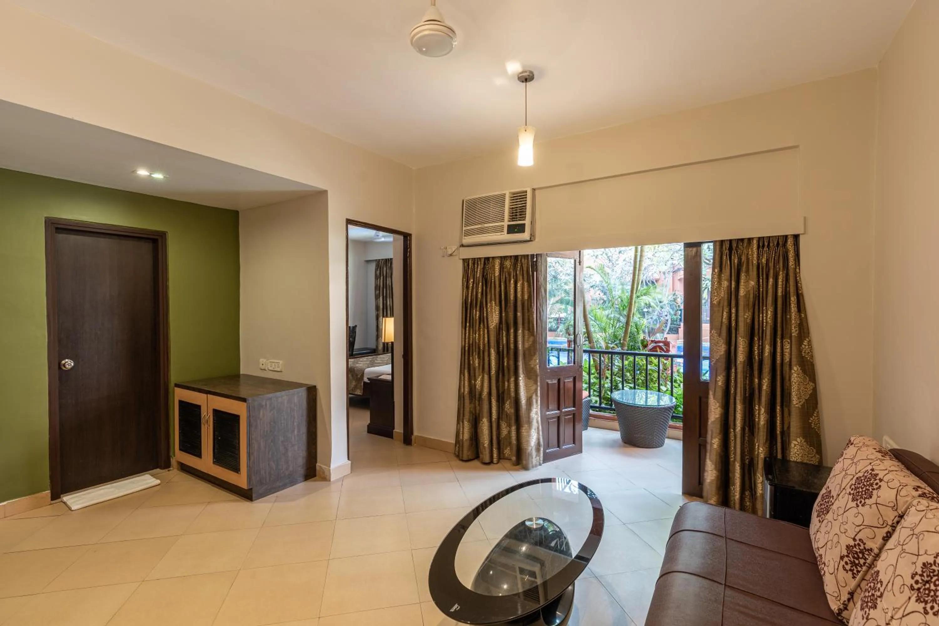 Living room, Bed in Neelam's The Grand Hotel Goa