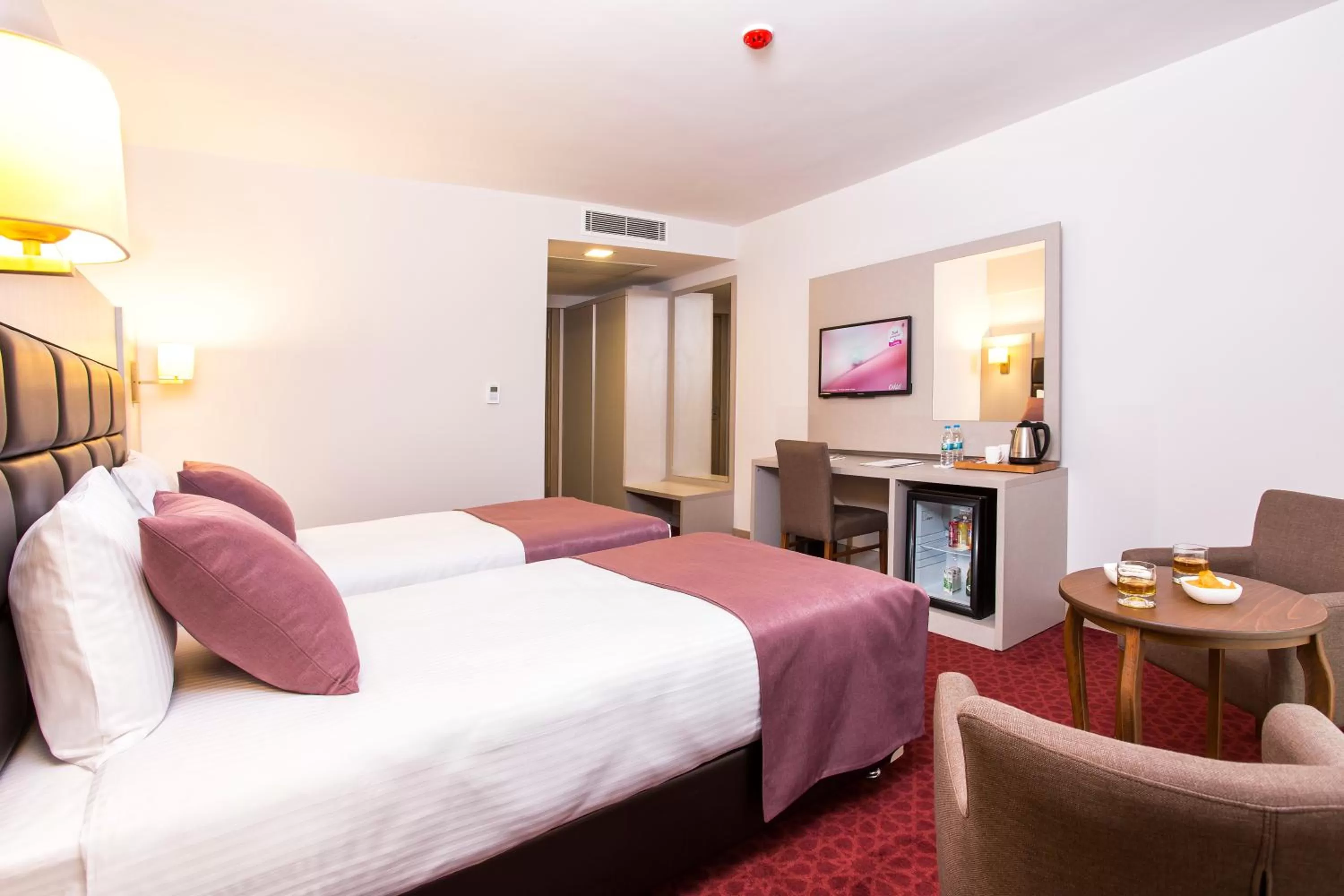 Bed in Perla Arya Hotel