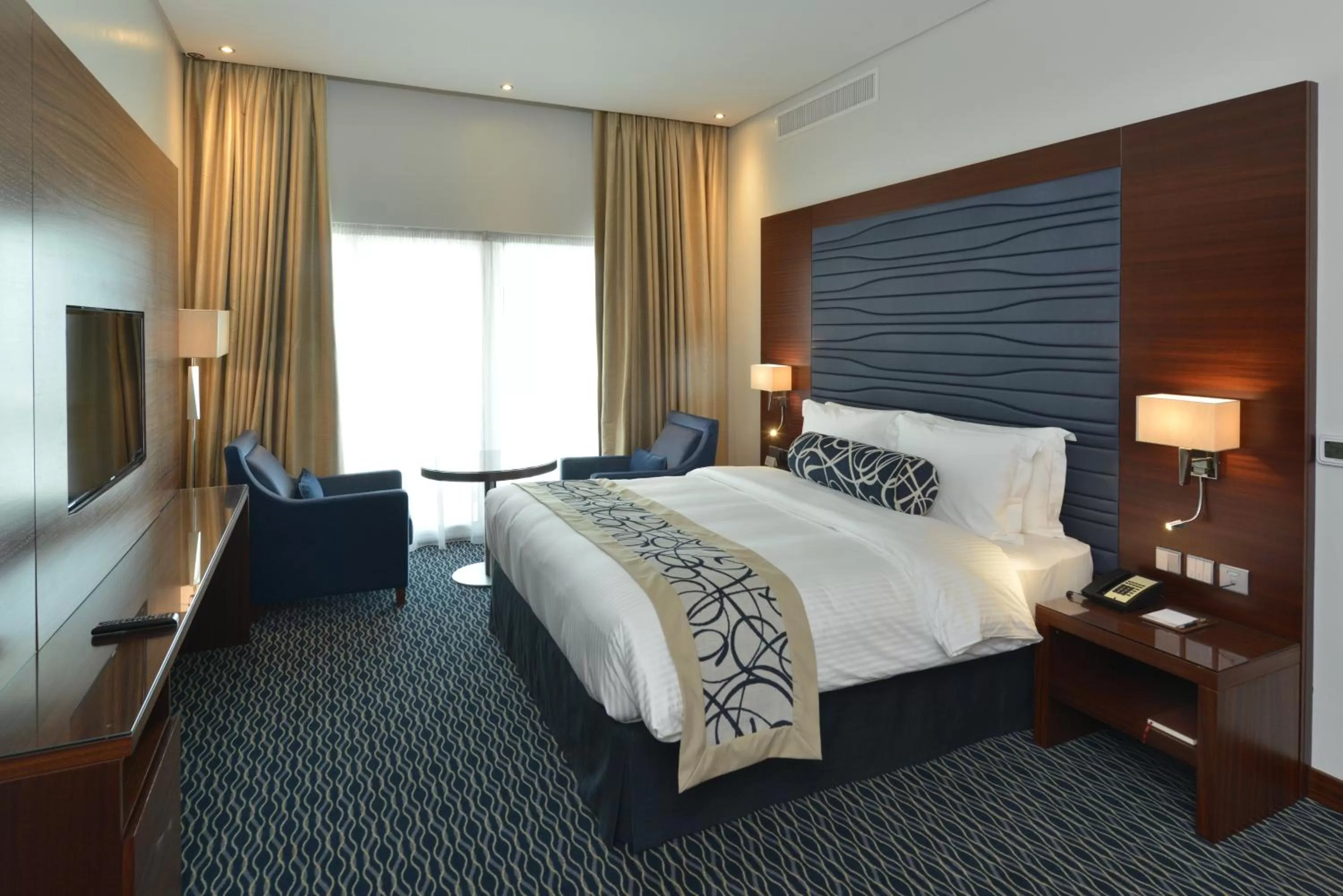 Shower, Bed in Ramada by Wyndham Manama City Centre