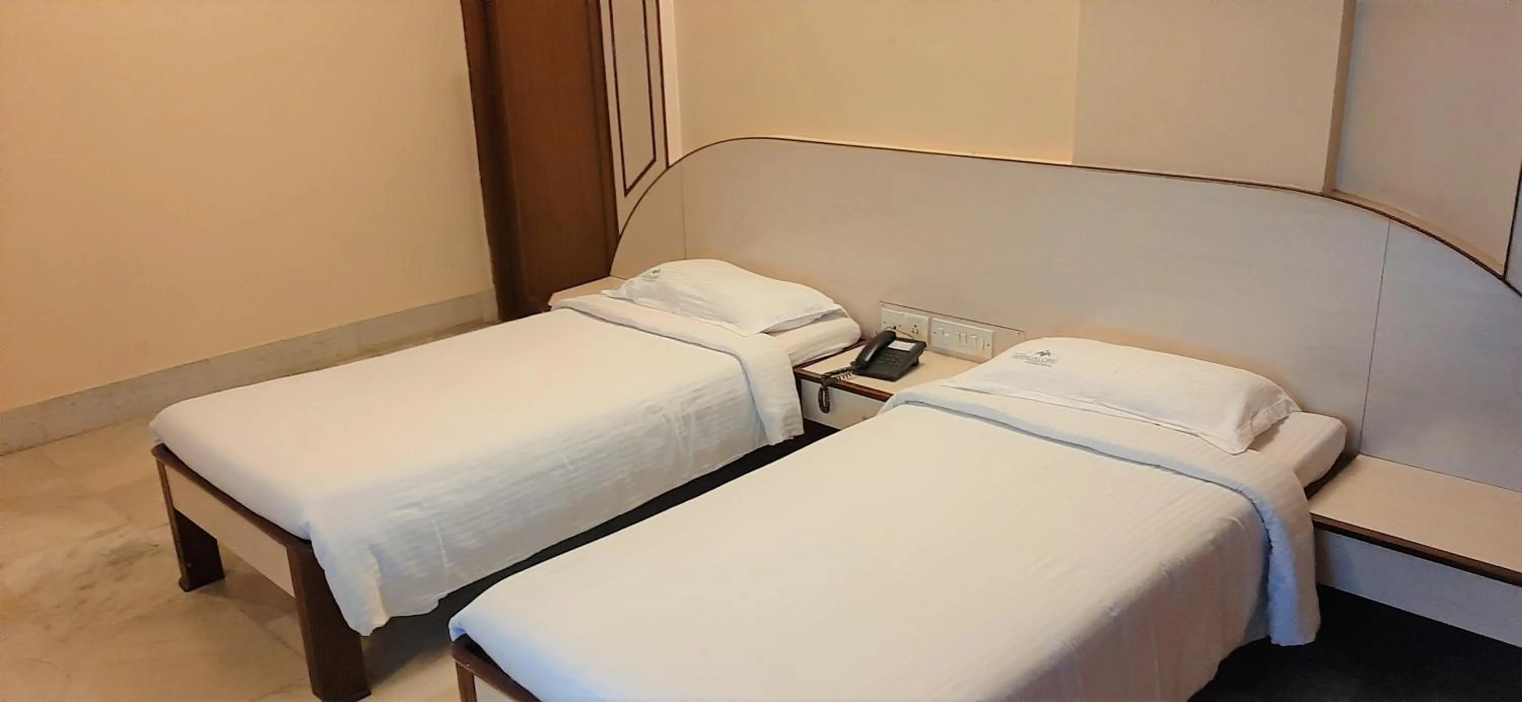 Bed in Hotel Mangalore International