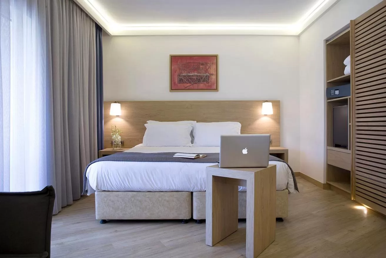 Bed in Golden Age Athens Hotel