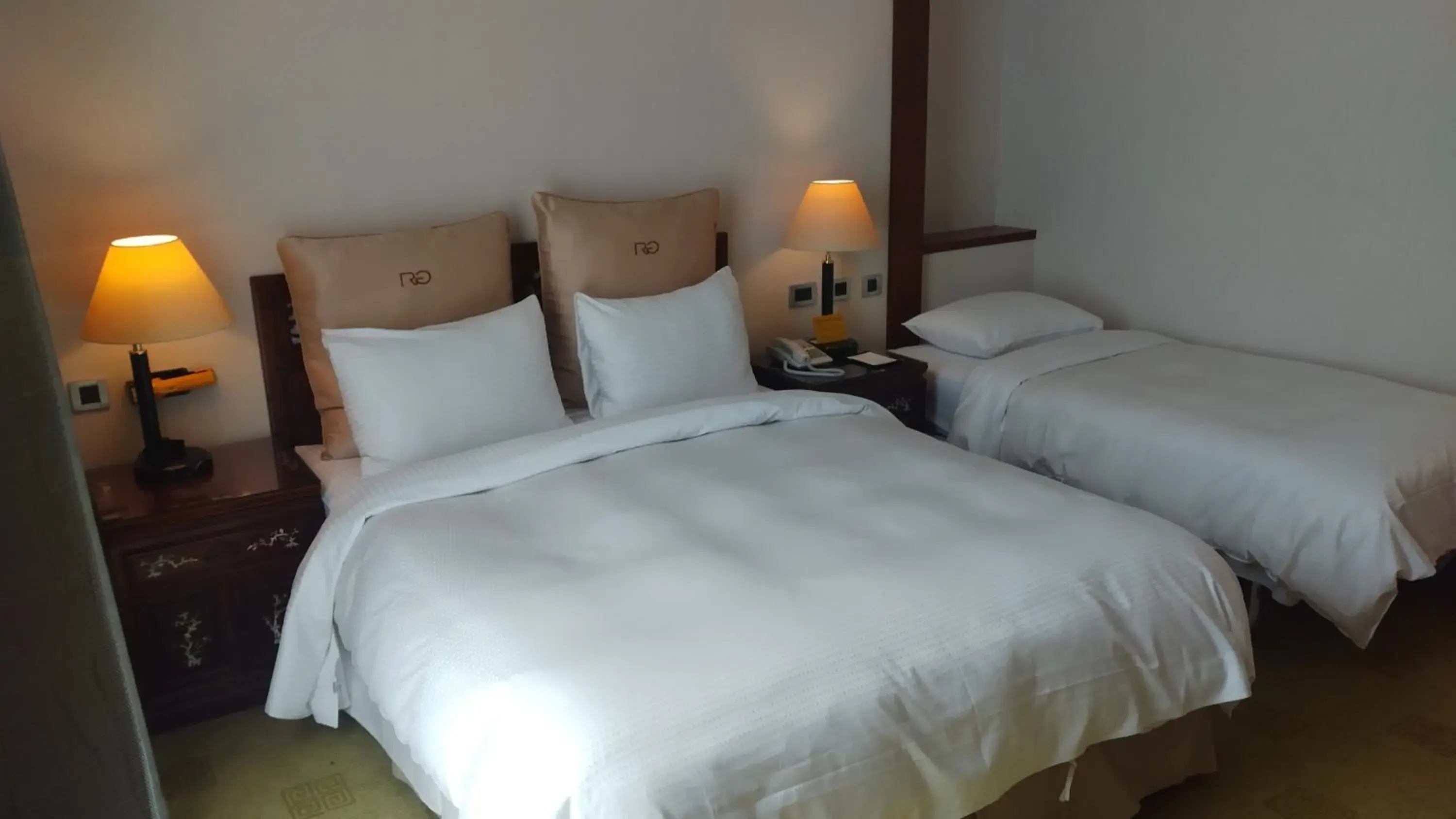 Bed in Rich Garden Hotel