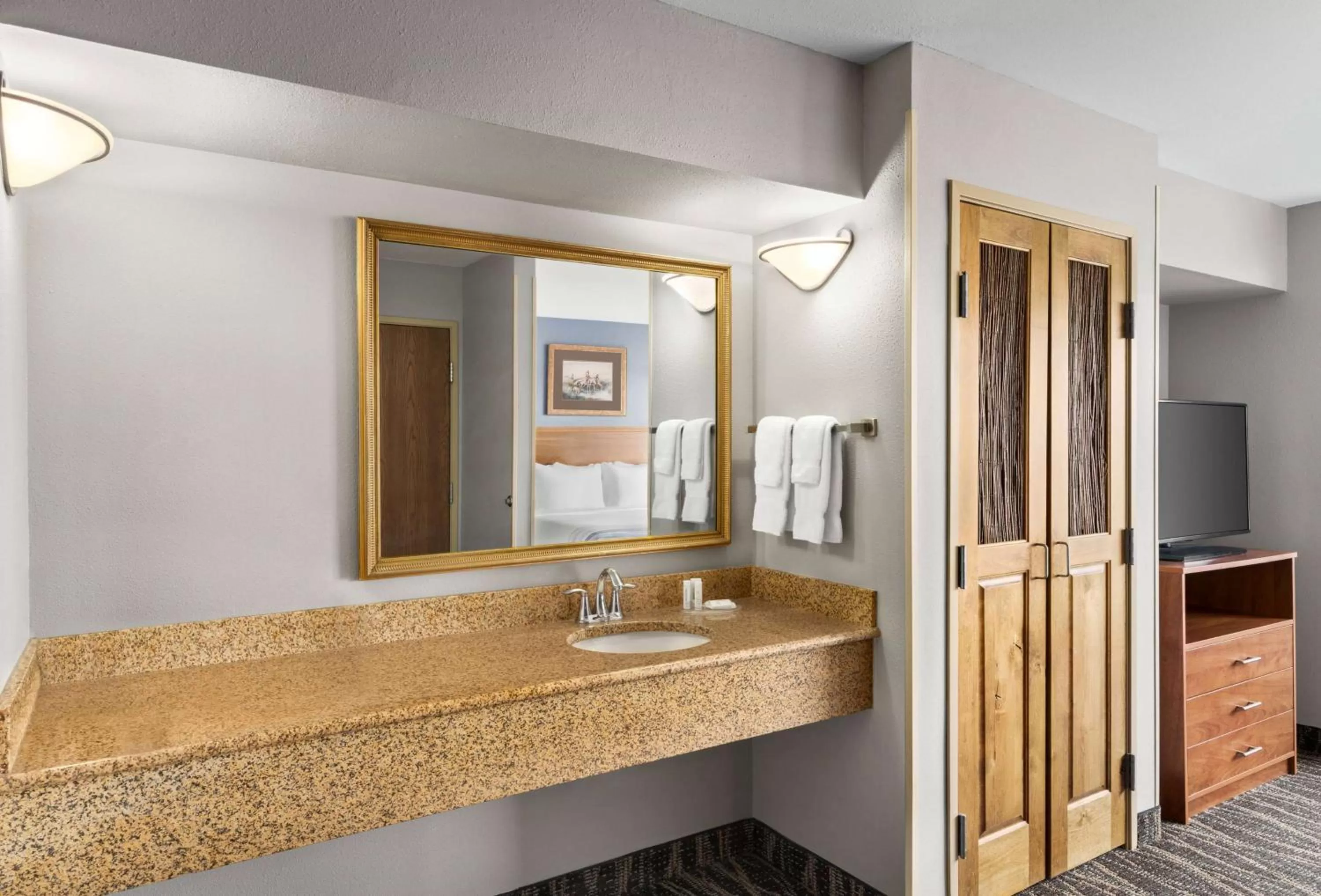 Bed in AmericInn by Wyndham Laramie Near University of Wyoming