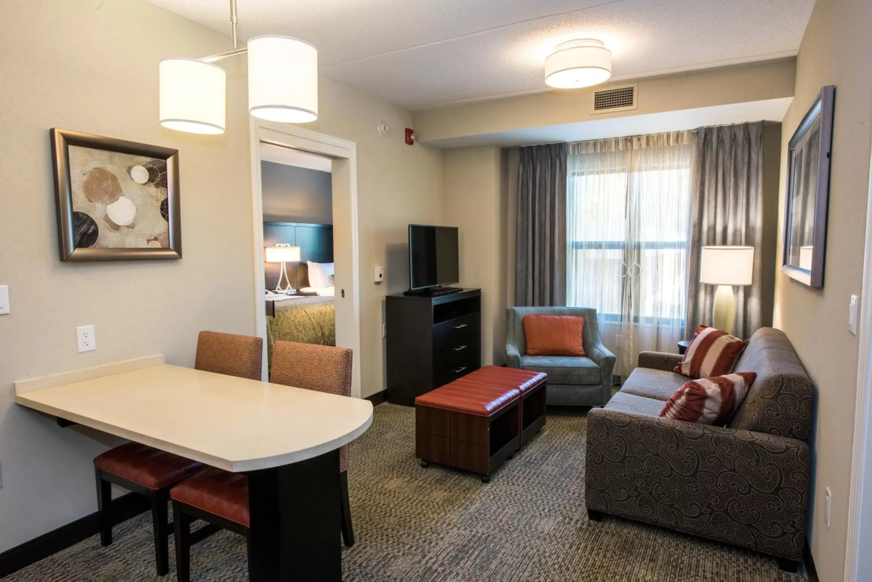Photo of the whole room, Seating Area in Staybridge Suites Albany Wolf Rd-Colonie Center, an IHG Hotel