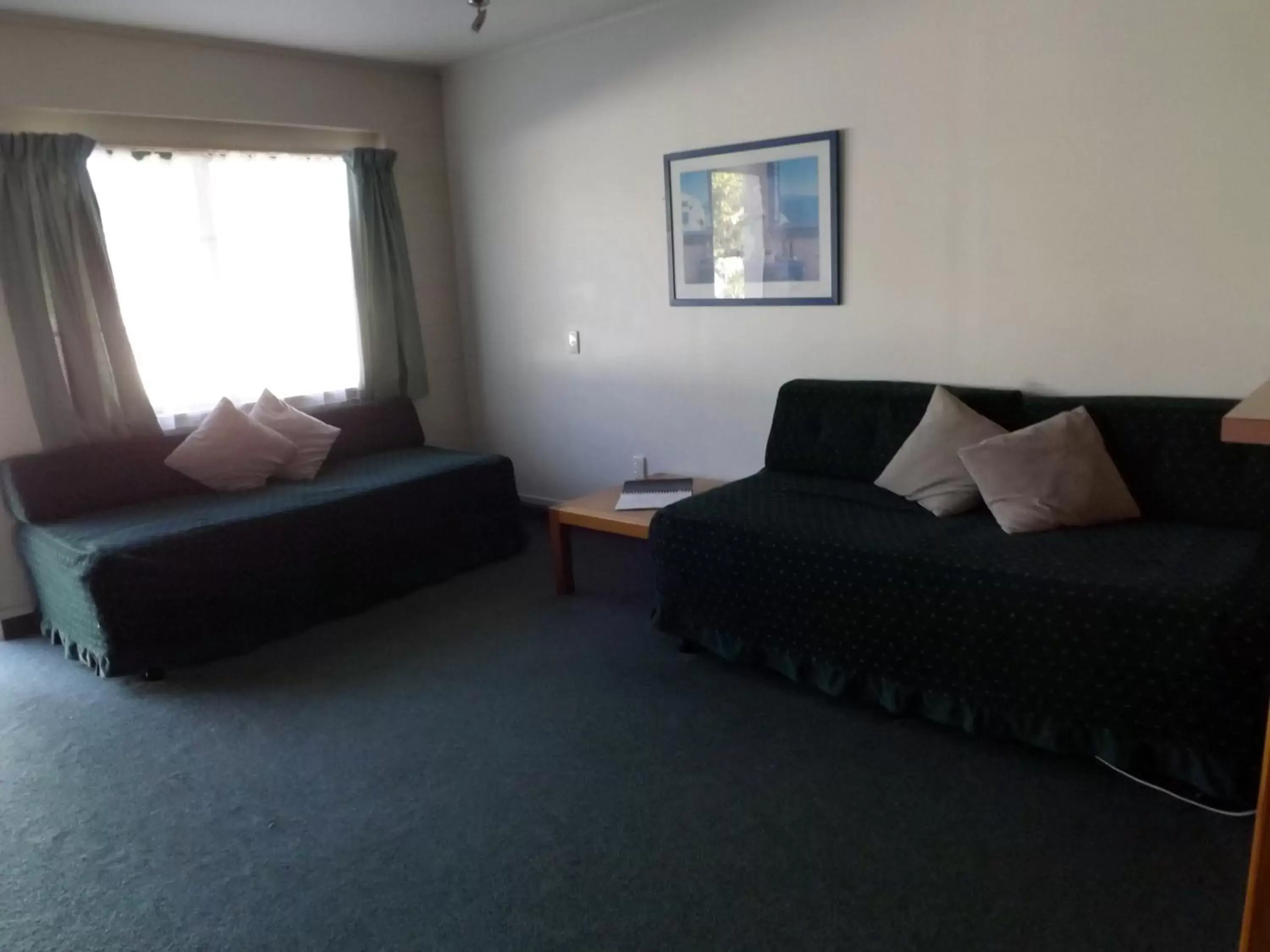 Photo of the whole room, Seating Area in Karaka Tree Motel