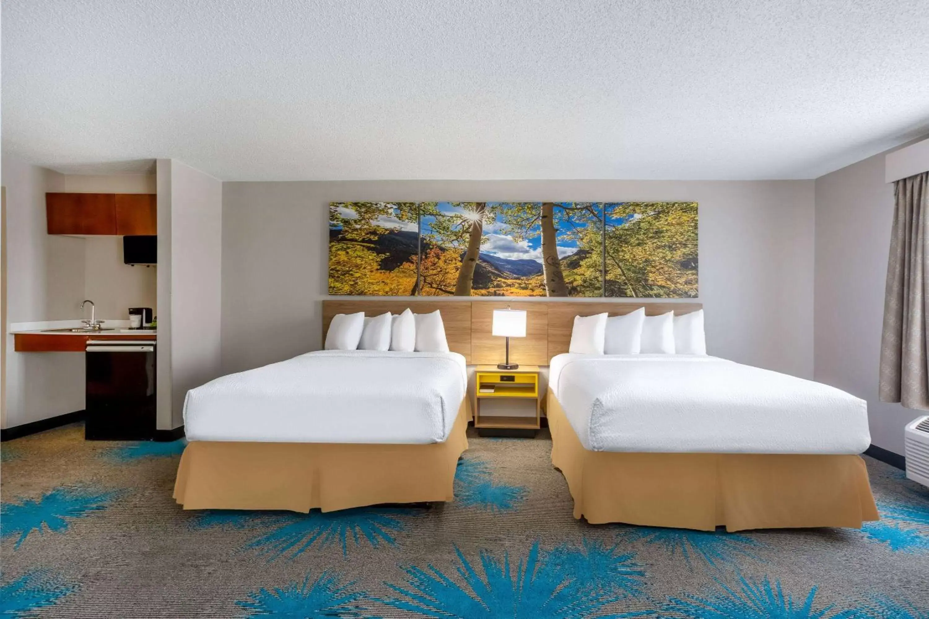 Bed in Days Inn & Suites by Wyndham Denver International Airport