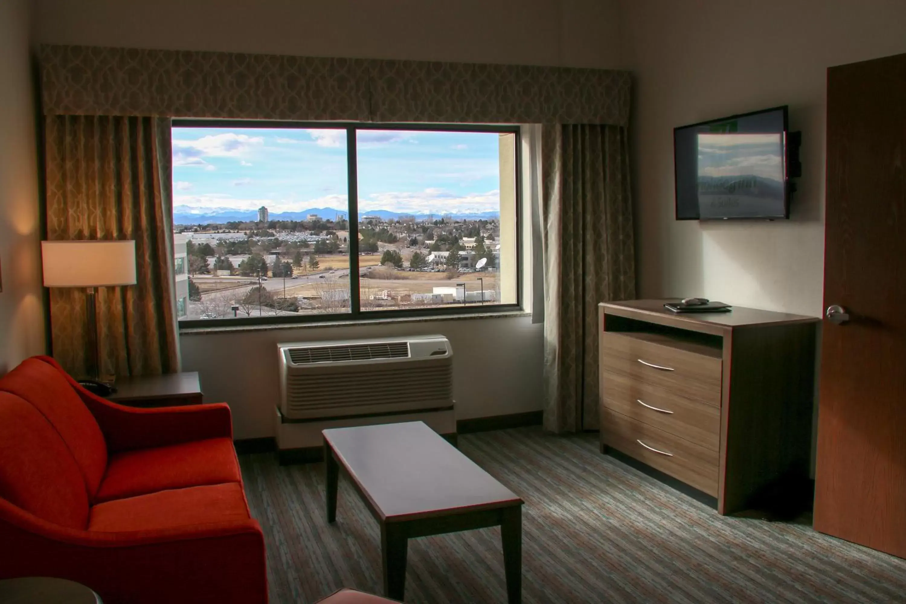 Bedroom, TV/Entertainment Center in Holiday Inn Hotel & Suites Denver Tech Center-Centennial, an IHG Hotel