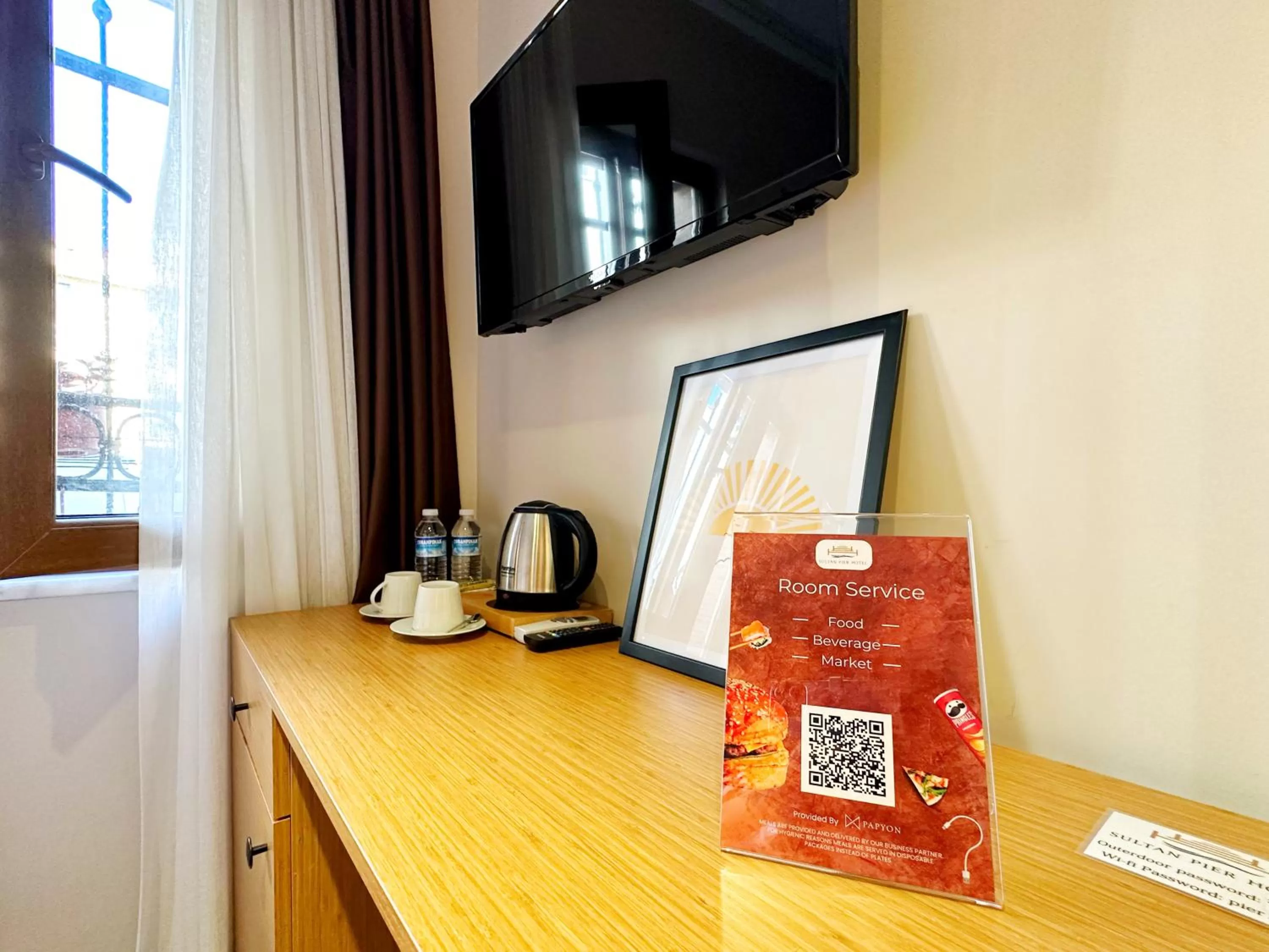 Property logo or sign in Sultan Pier Hotel