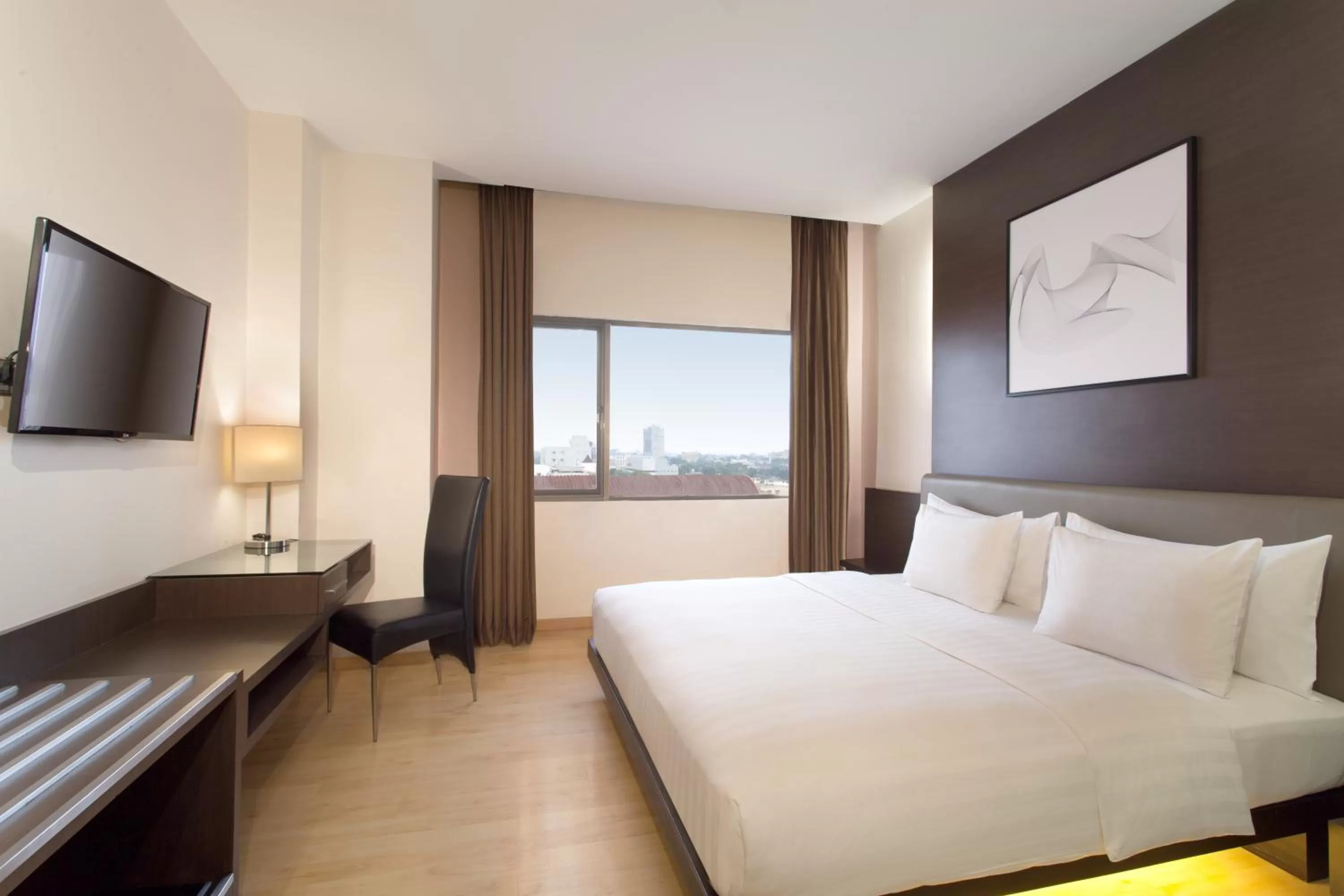 Photo of the whole room, Bed in AIHO Hotel Medan