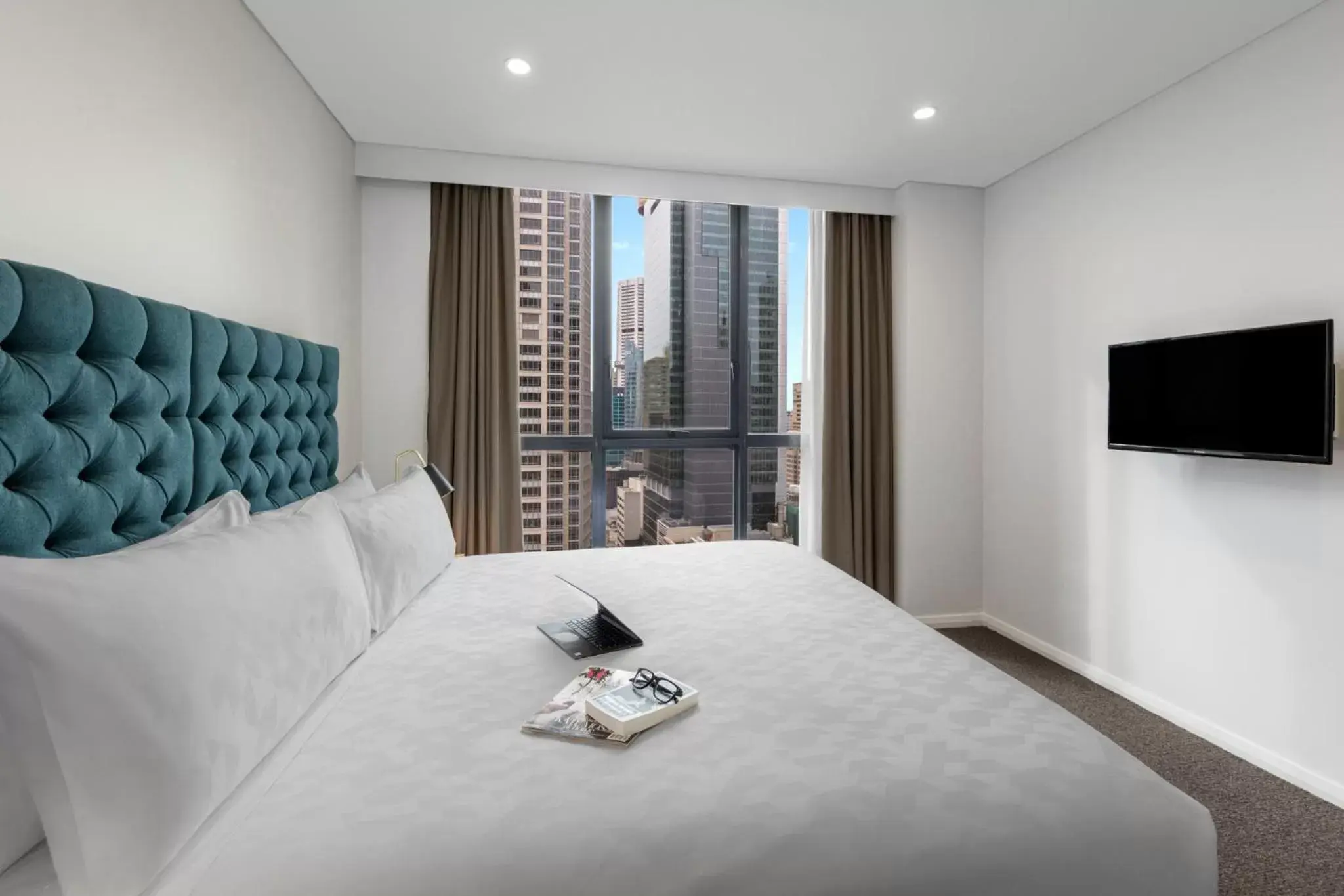 Bed in Meriton Suites Pitt Street, Sydney