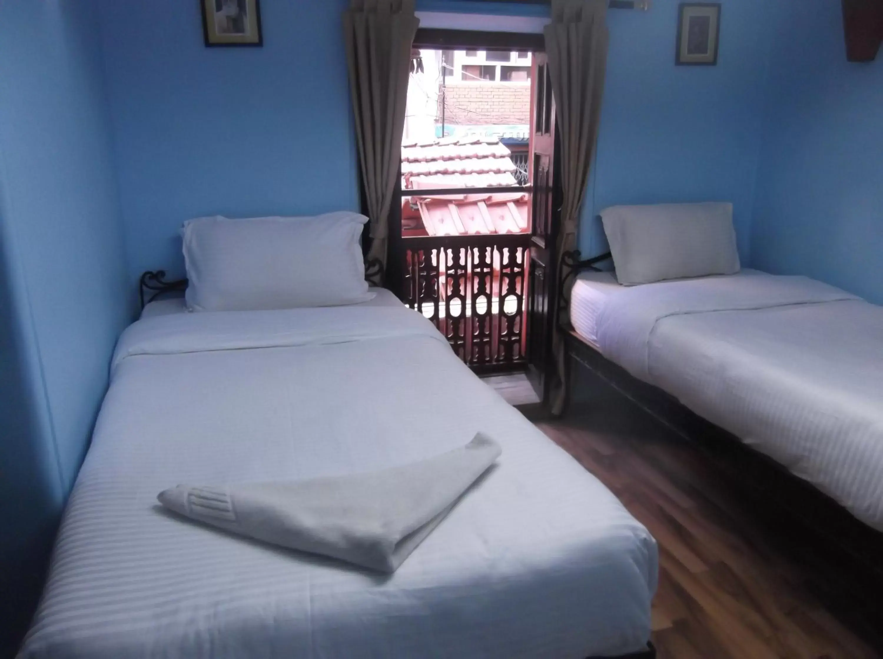 Photo of the whole room, Bed in Kathmandu Boutique Hotel