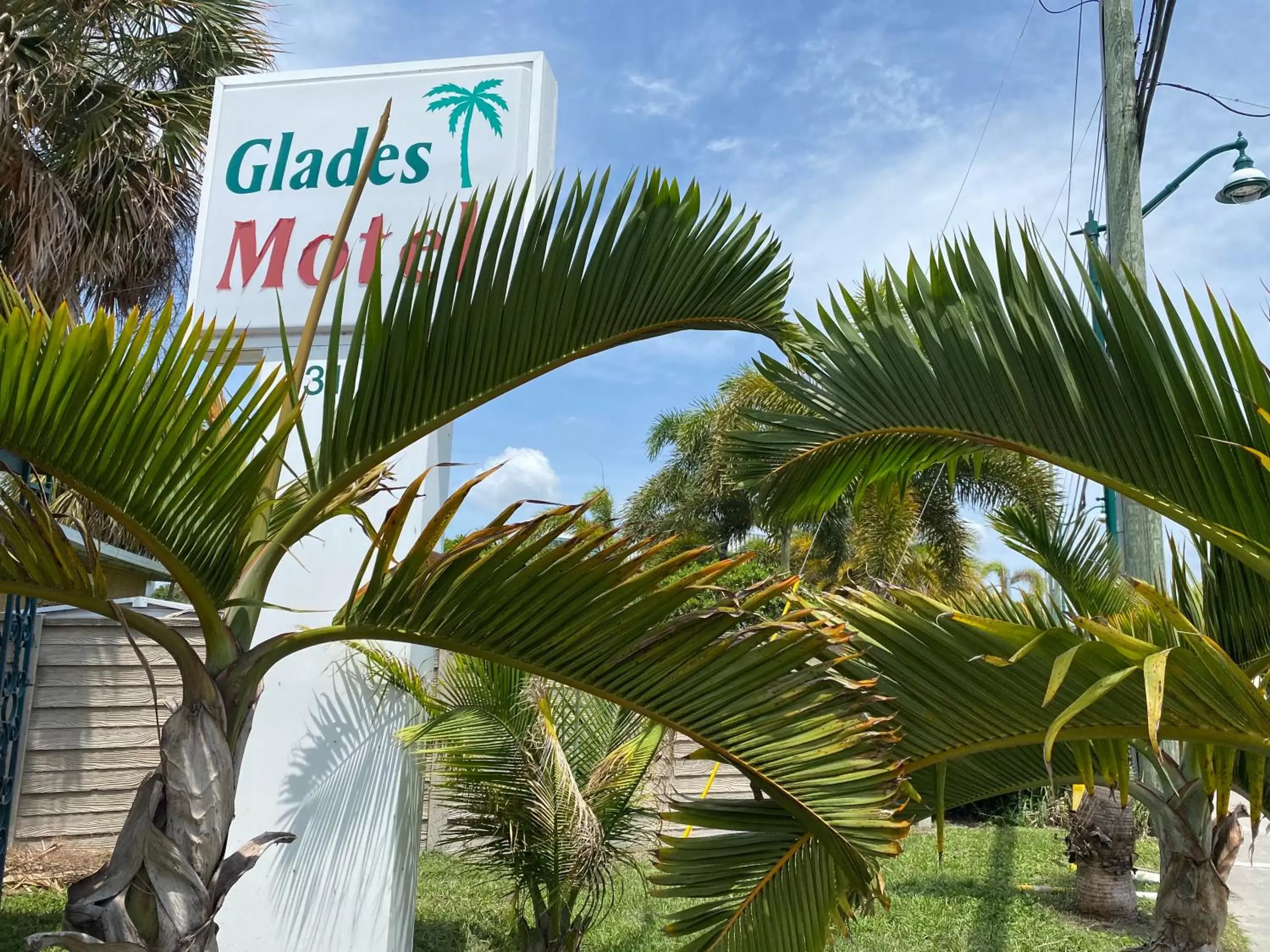 Property logo or sign in Glades Motel - Naples