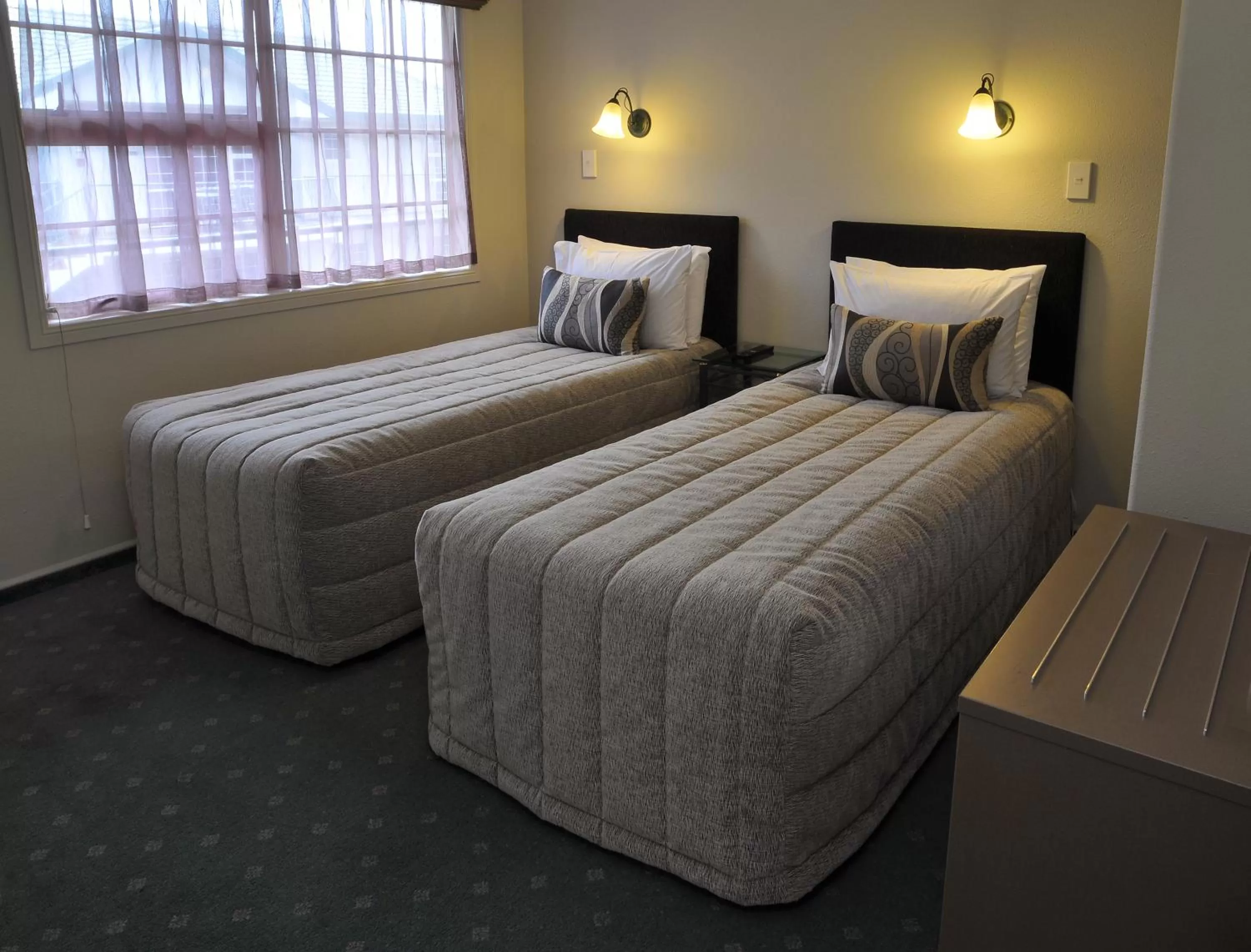 Bed in Silver Fern Rotorua Suites & Spa