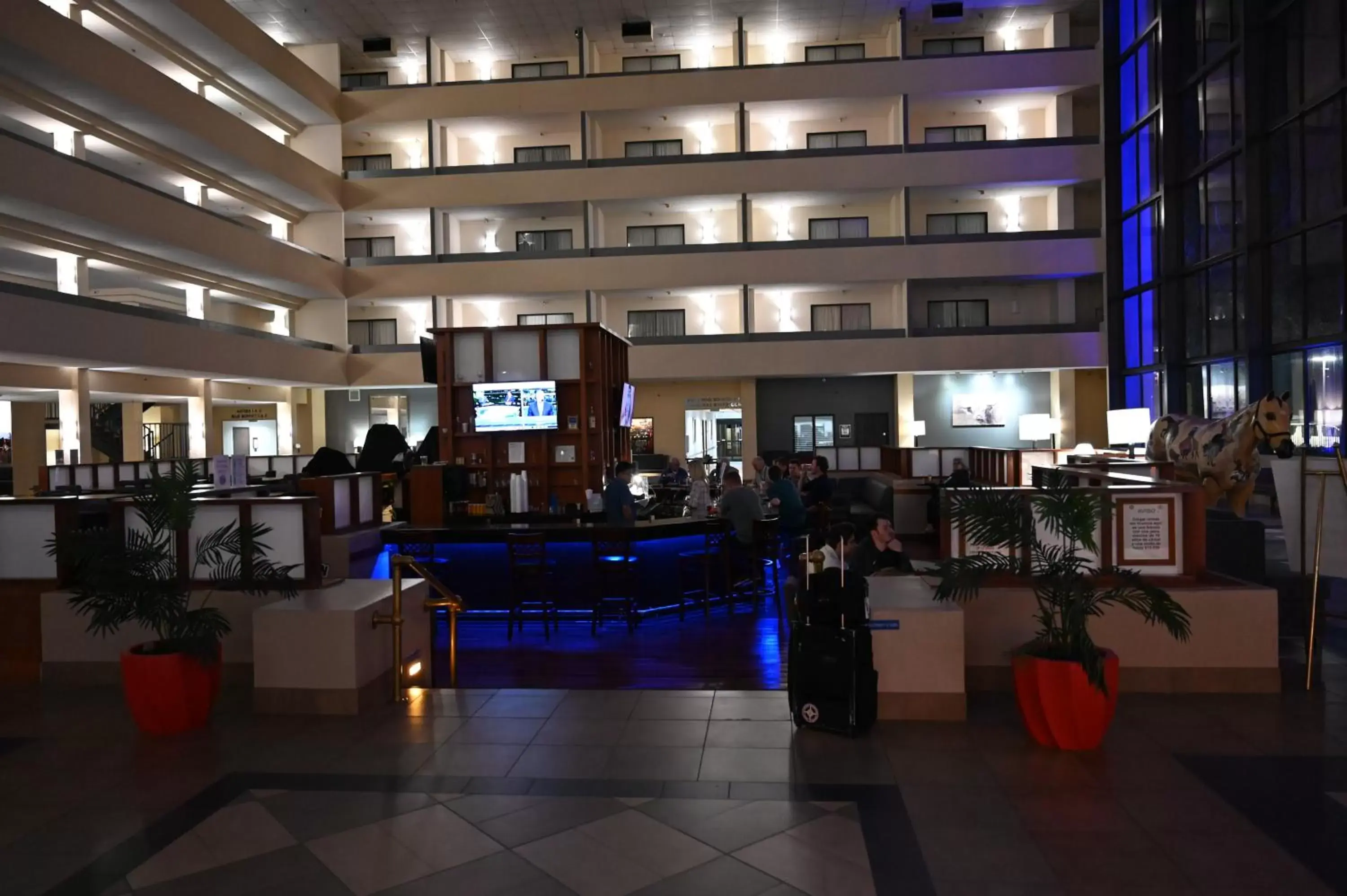 Communal lounge/ TV room in Atrium Hotel and Suites DFW Airport