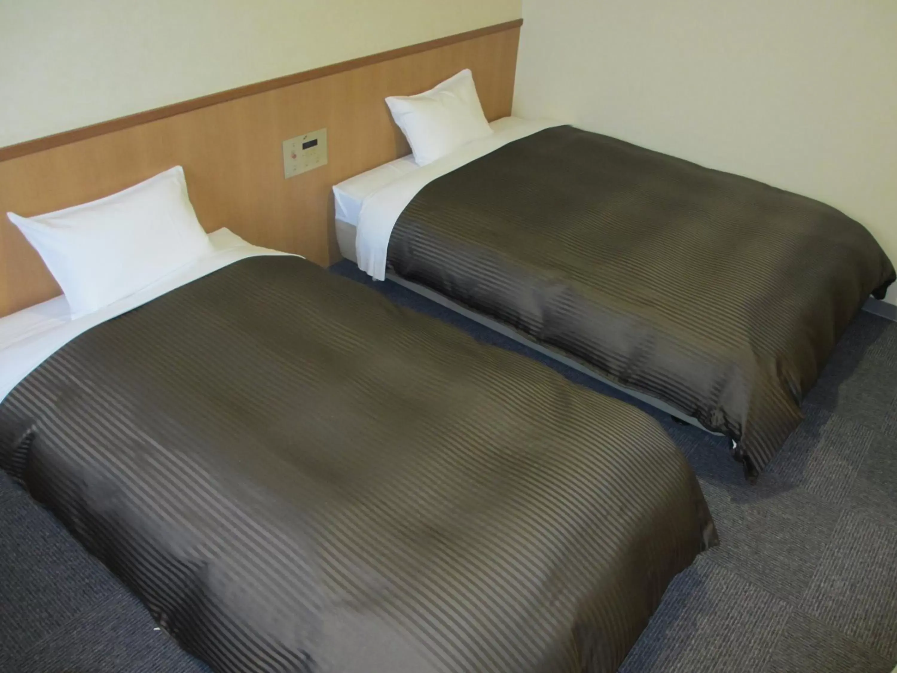 Bed in Hotel Axia Inn Kushiro