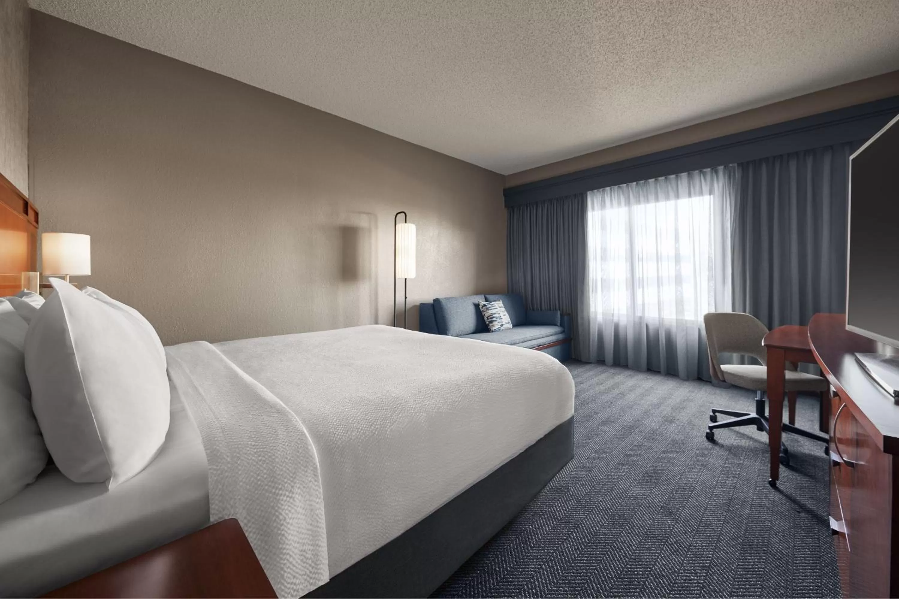 King Room with Sofa Bed - Hearing Accessible in Courtyard by Marriott St. Louis Downtown West