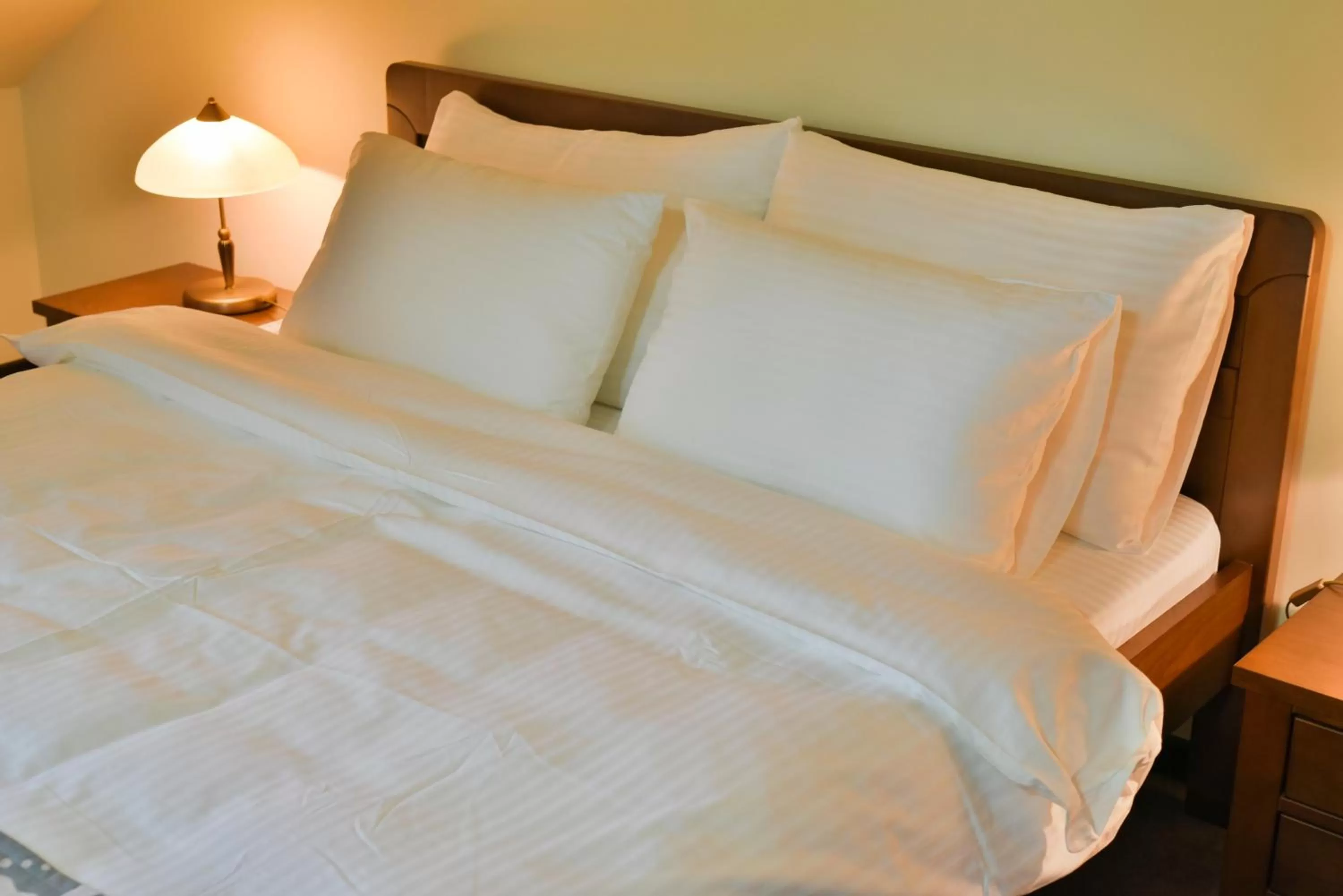 Bed in Garni Hotel Central Lux