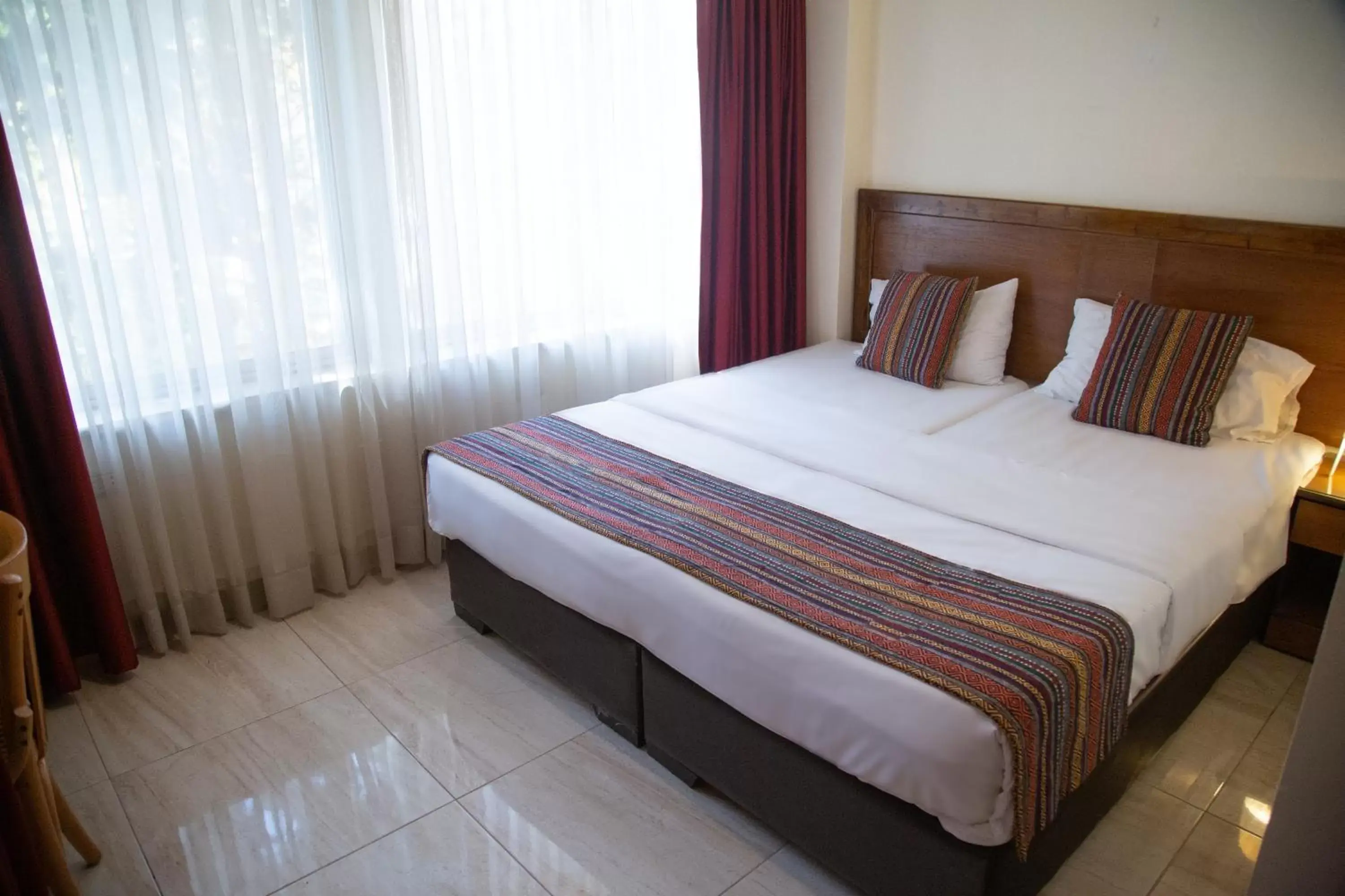 Bed in Antika Amman Hotel