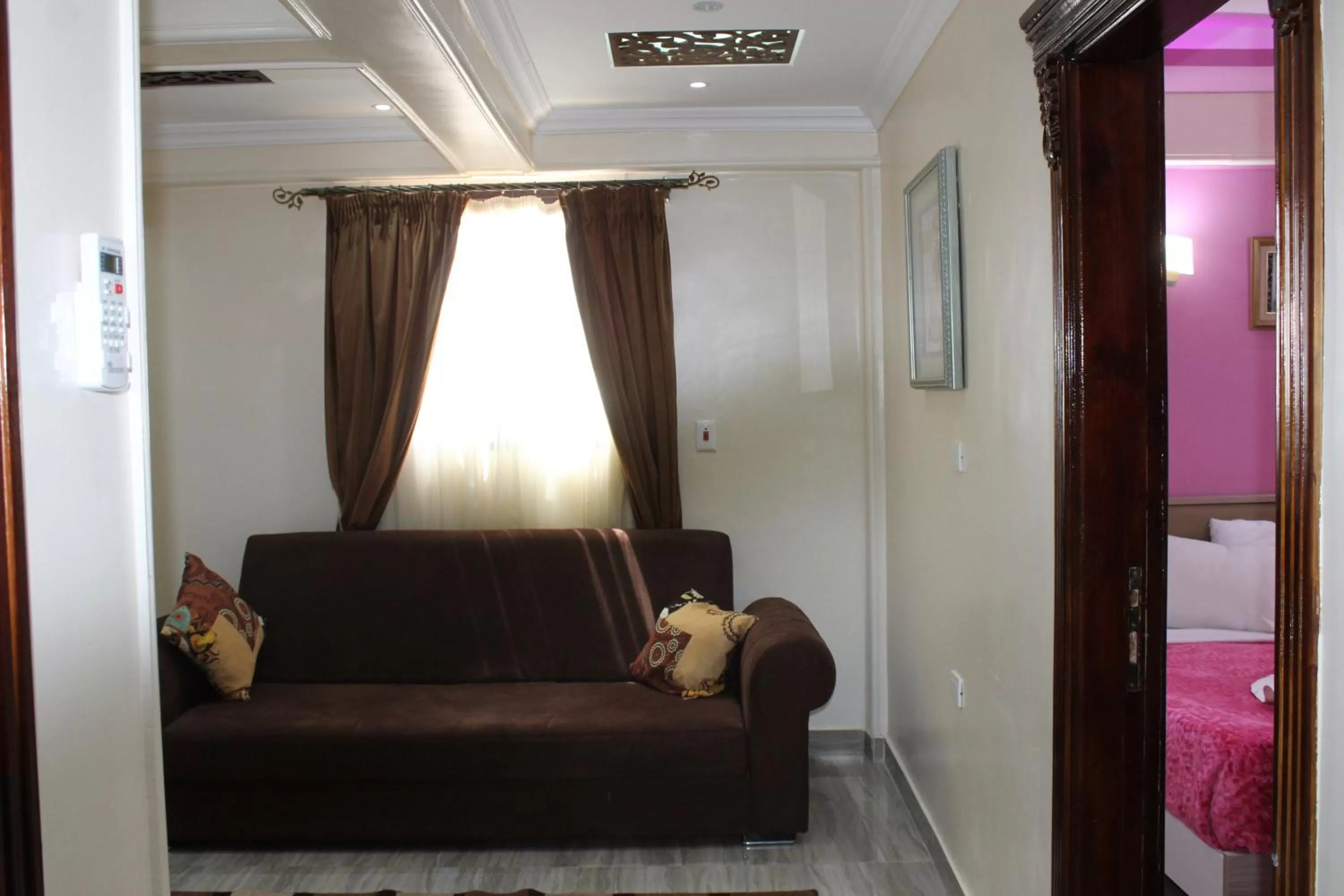 Communal lounge/ TV room, Bed in Amin Hotel