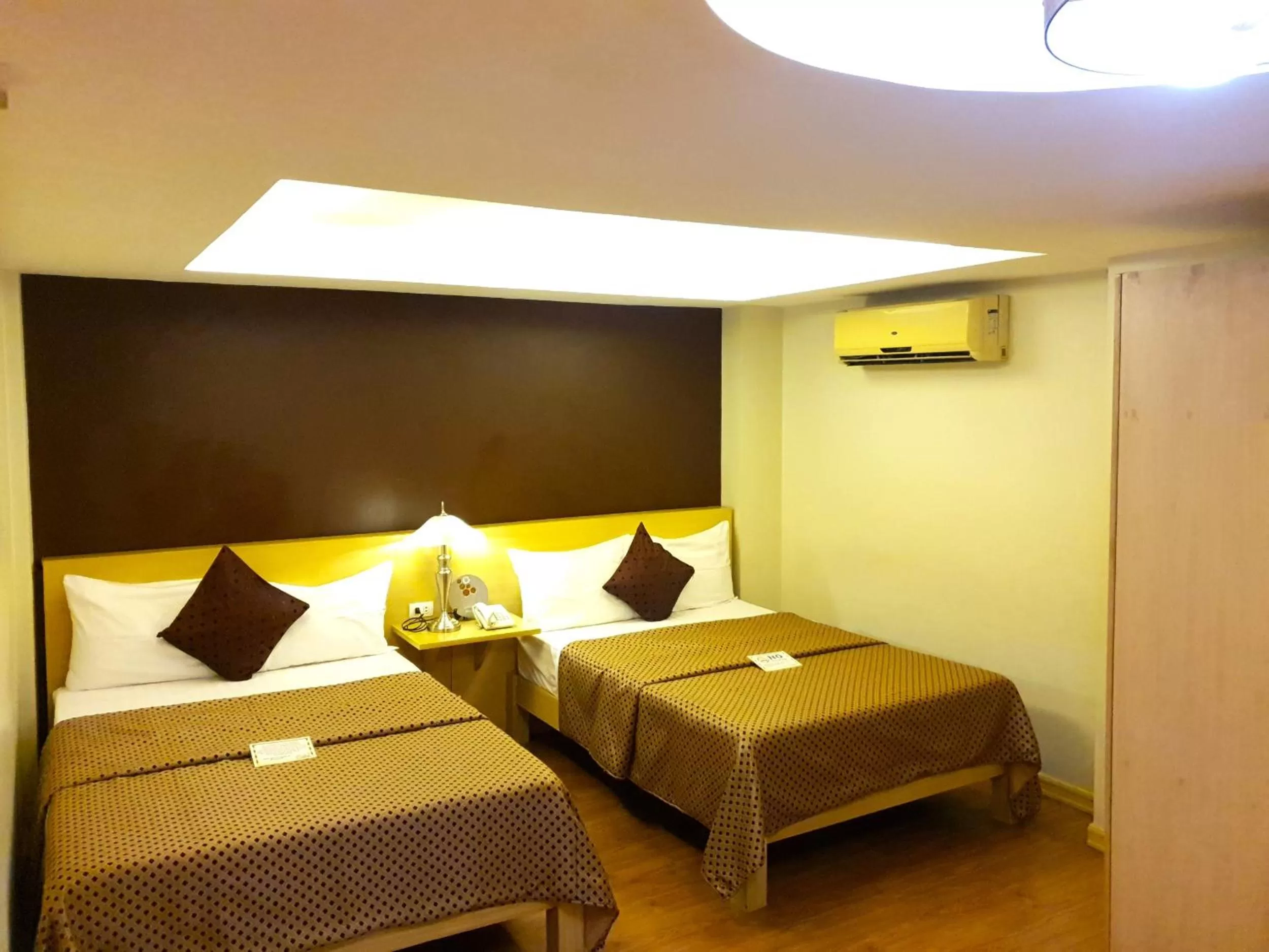 Bed in Festive Hotel Makati