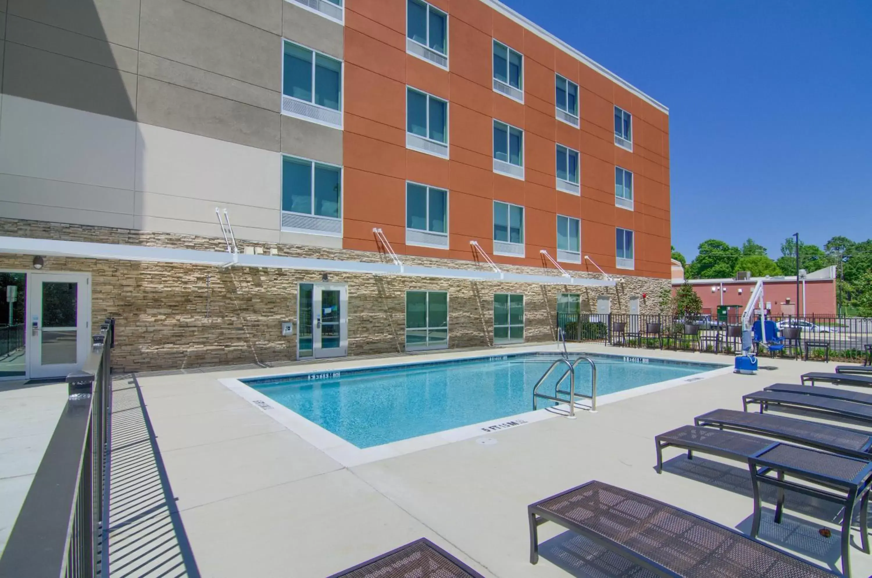 Swimming Pool in Holiday Inn Express & Suites Mobile - University Area, an IHG Hotel
