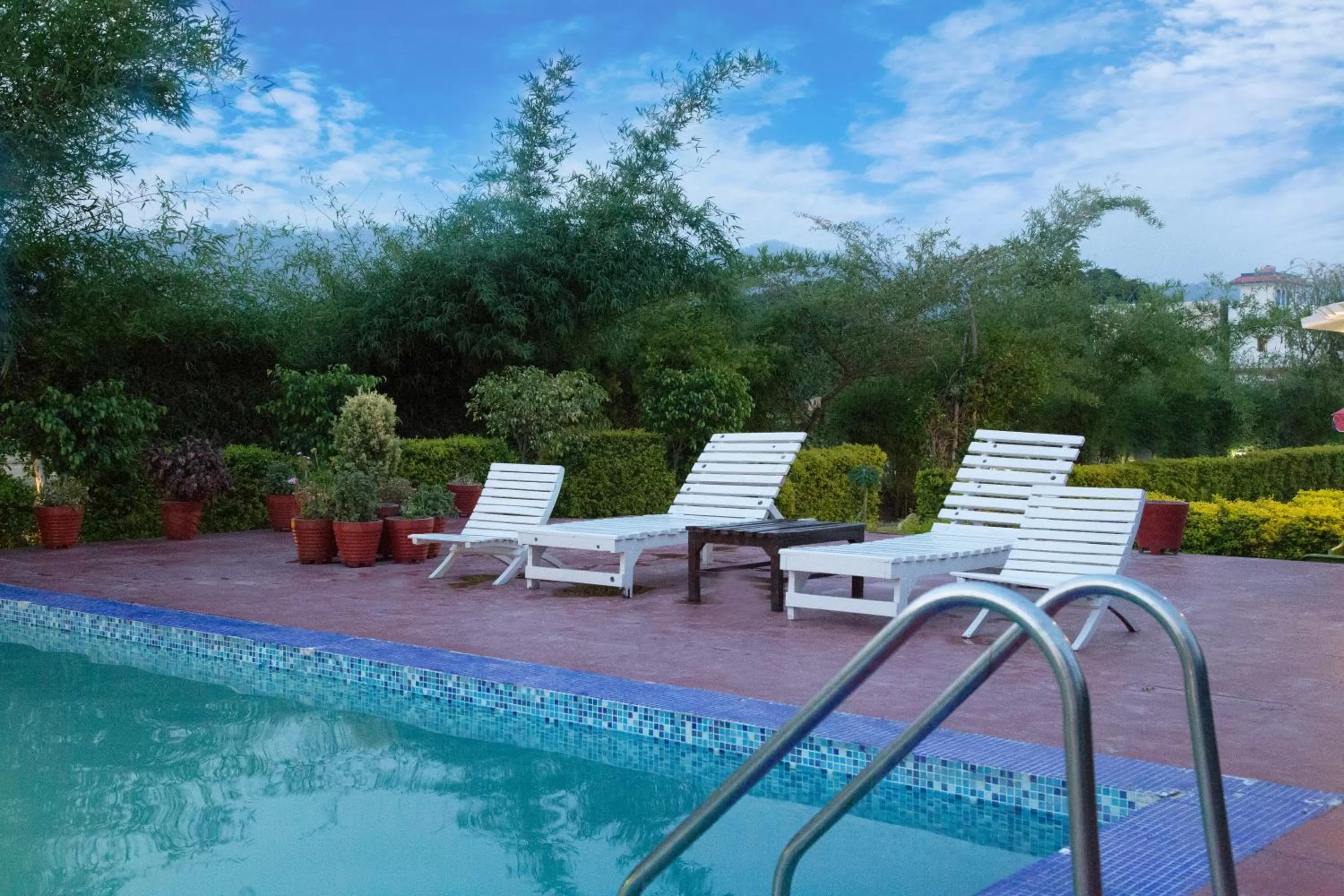 Swimming pool in Corbett Treat Resort By Atya Hotels