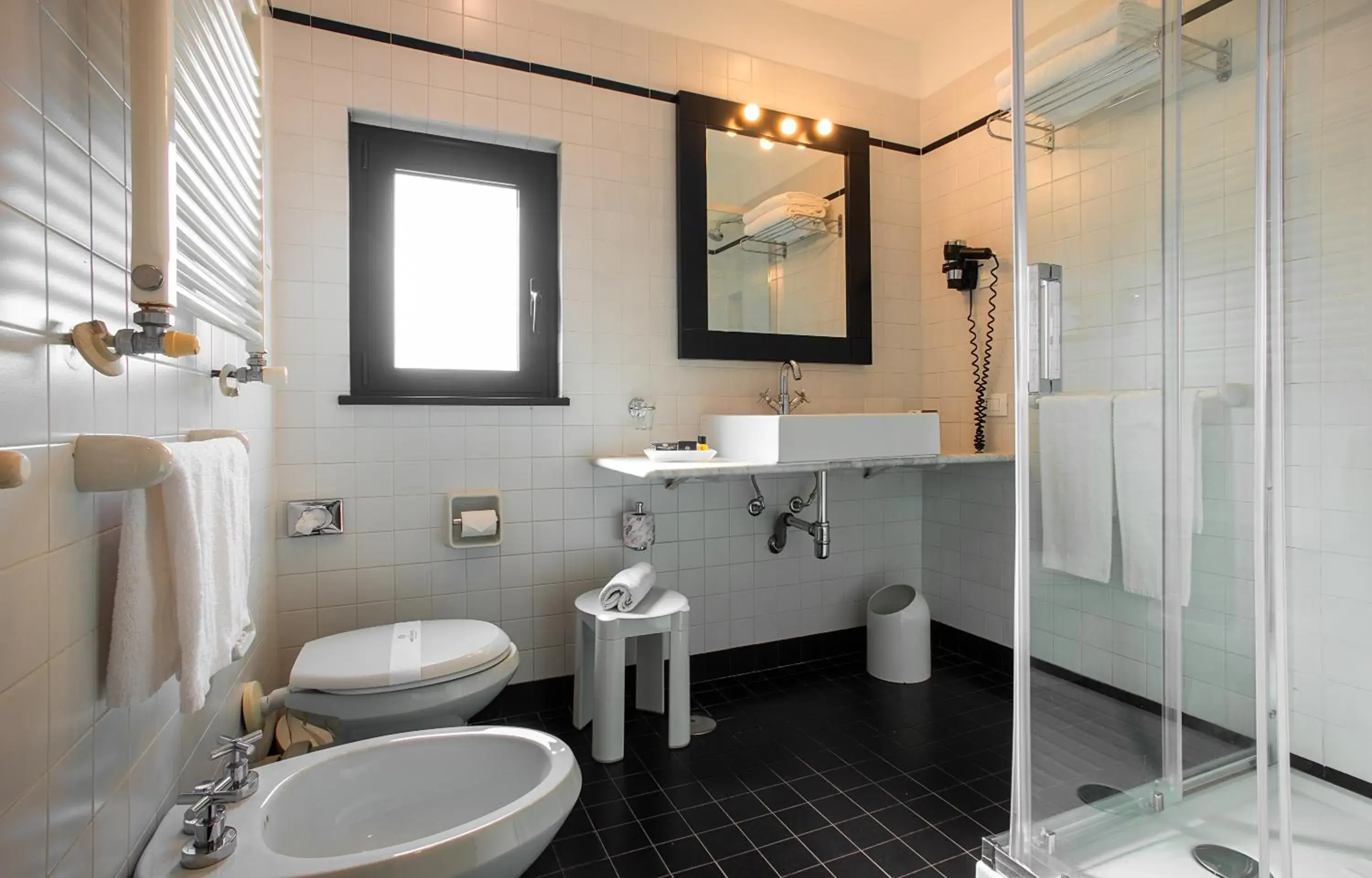 Bathroom in Sardegna Hotel - Suites & Restaurant