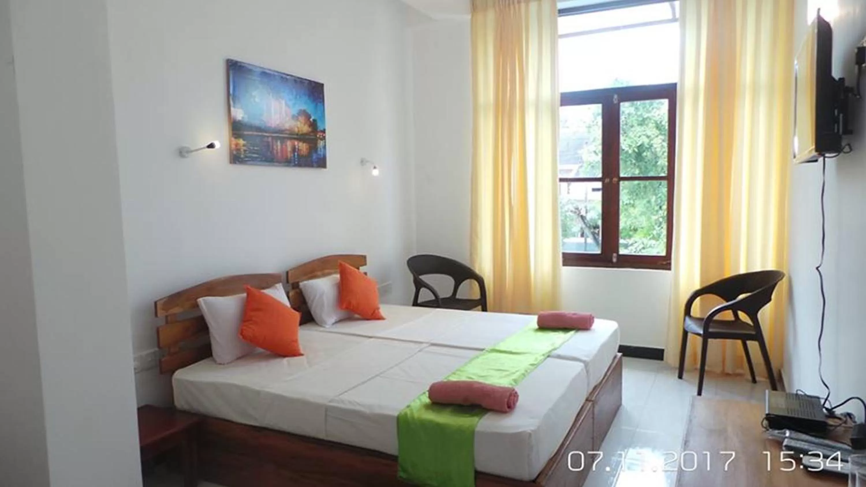 Bed in WindMill Beach Villa and Hotel