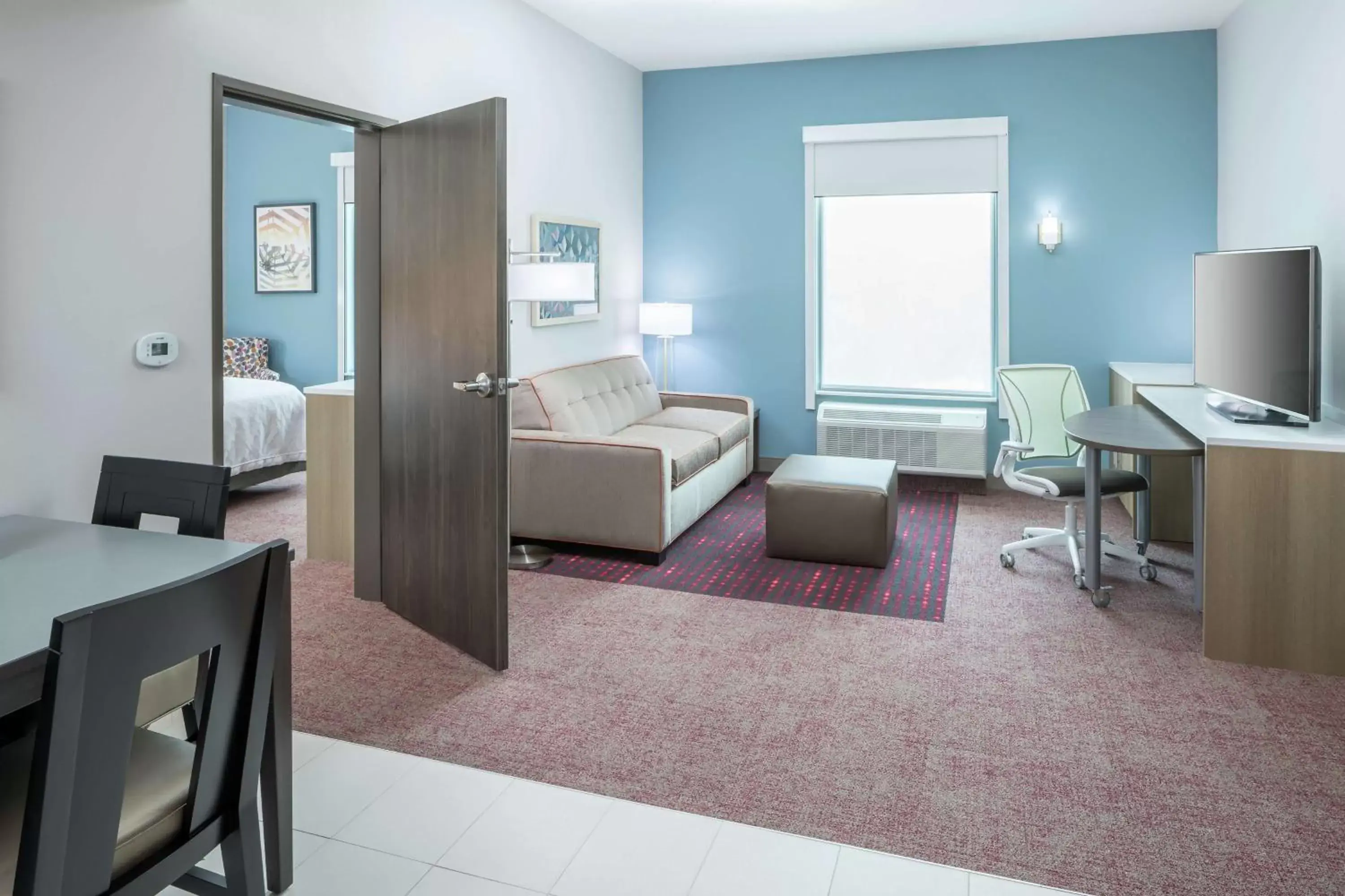 Bedroom in Home2 Suites By Hilton Orlando Airport