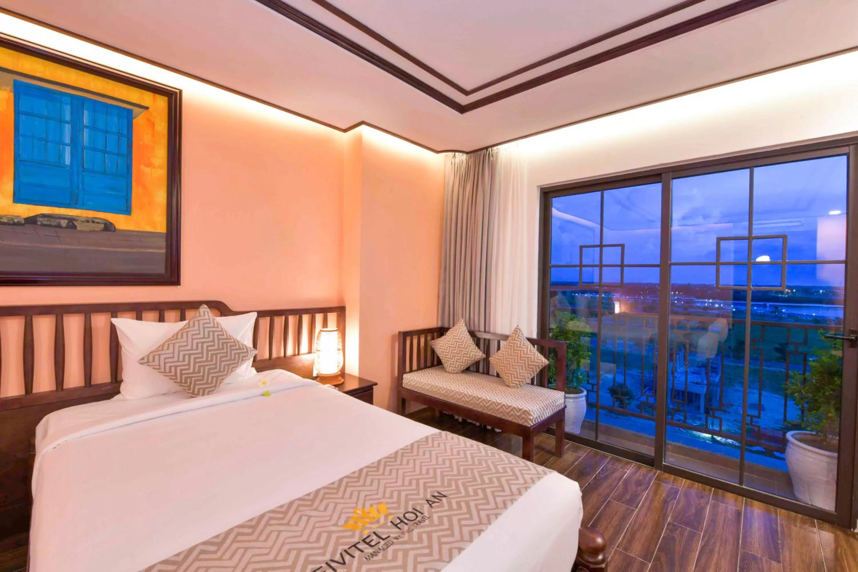 Photo of the whole room, Bed in Fivitel Hoi An Hotel