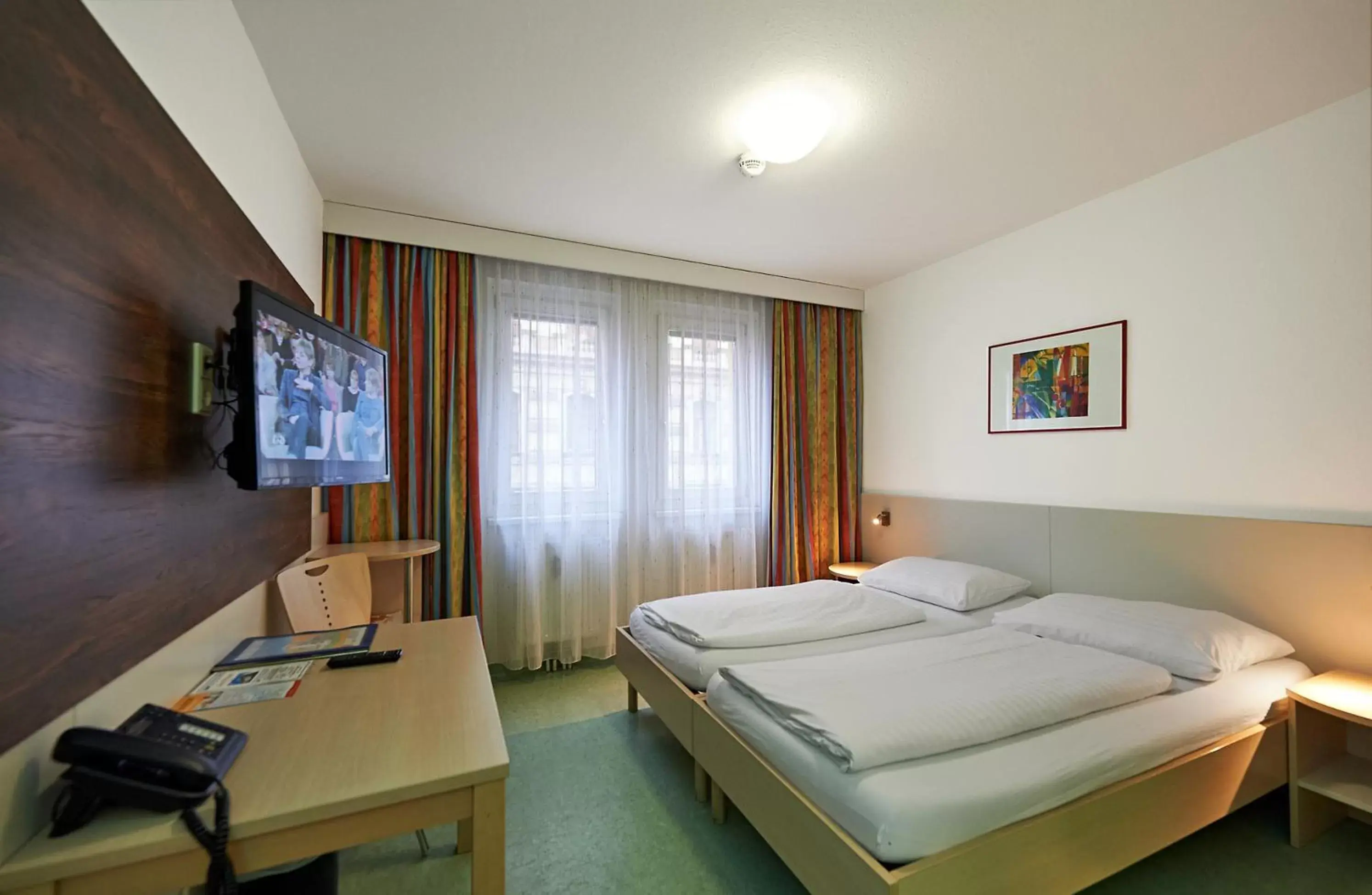 Photo of the whole room, TV/Entertainment Center in Hotel Kolping Wien Zentral