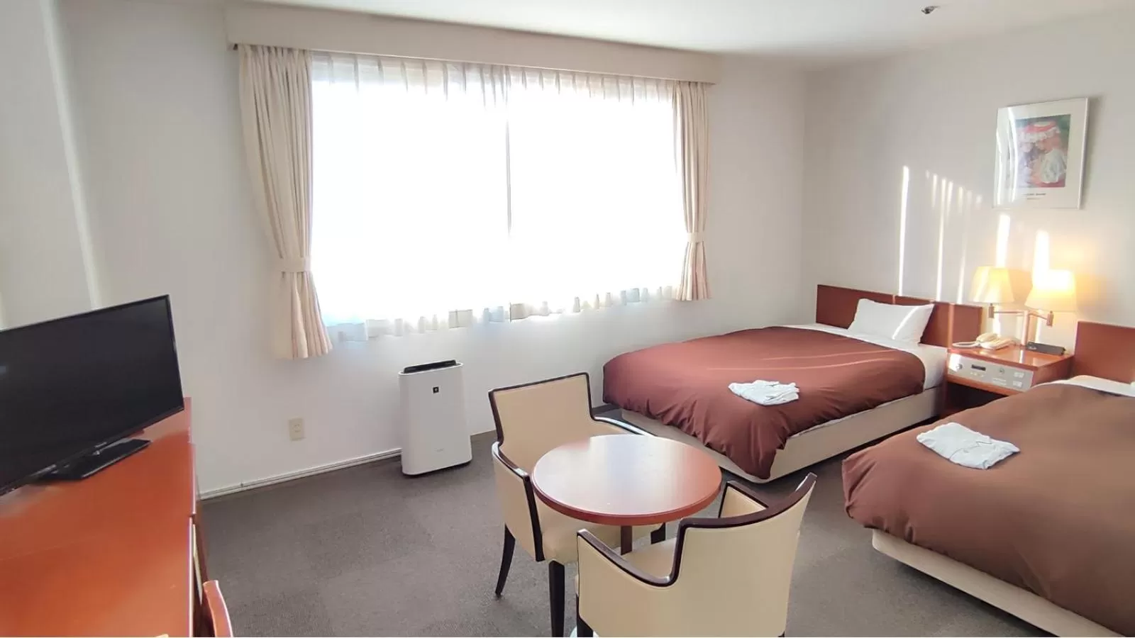 Communal lounge/ TV room, Bed in Utazu Grand Hotel