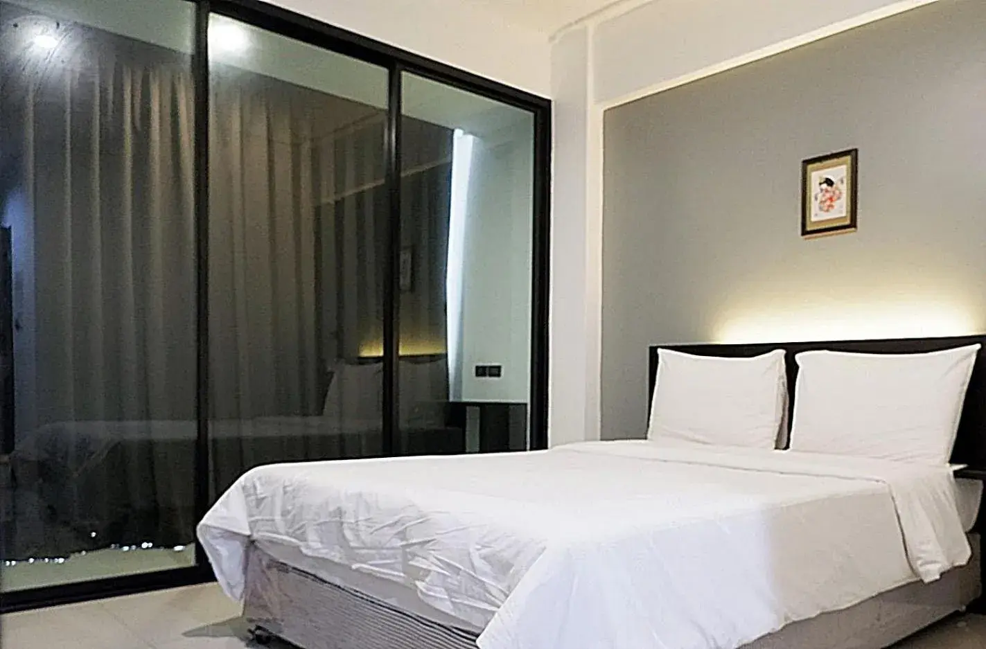 Bed in Izen Budget Hotel & Residence