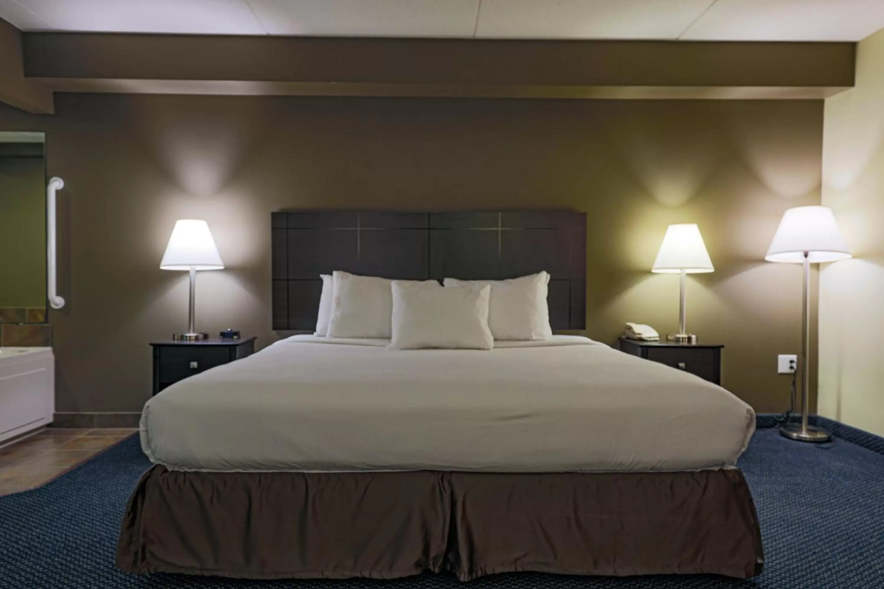 Bed in AmericInn by Wyndham Lincoln South